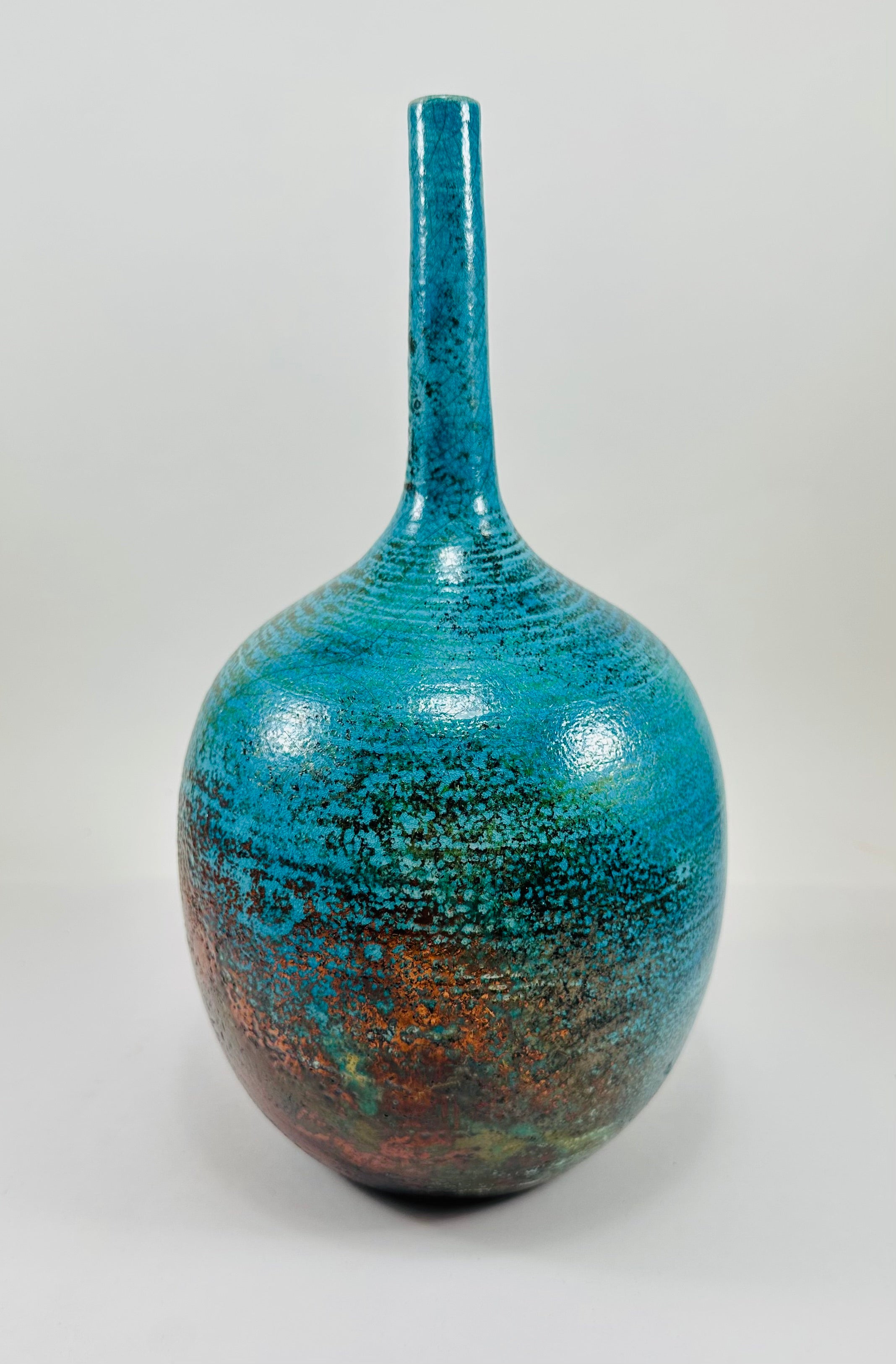 Handmade Raku vase in a beautiful turquoise and copper glaze.