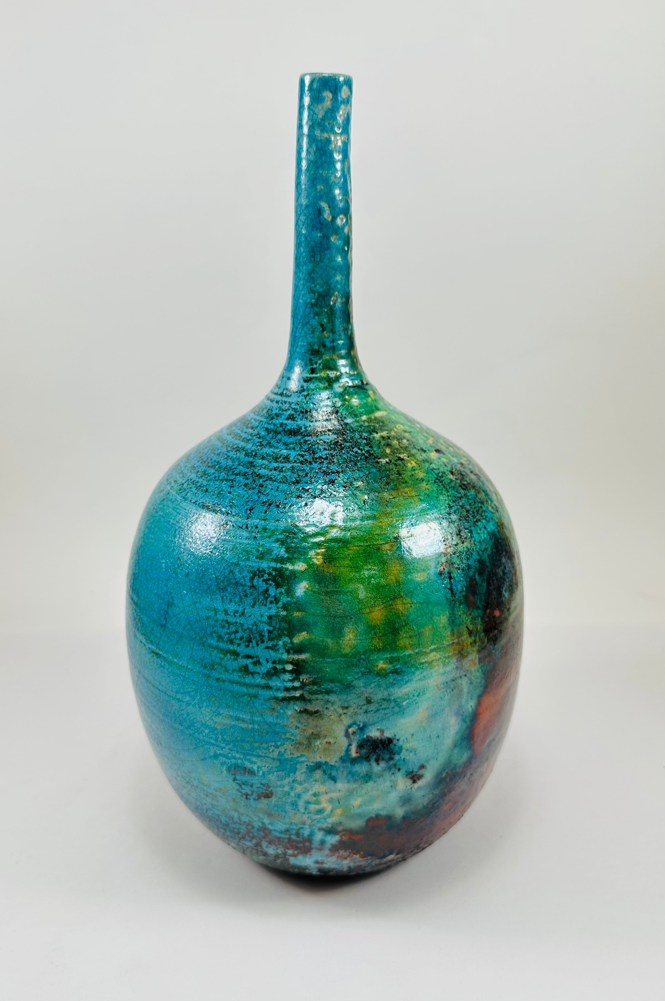 Handmade Raku vase in a beautiful turquoise and copper glaze.