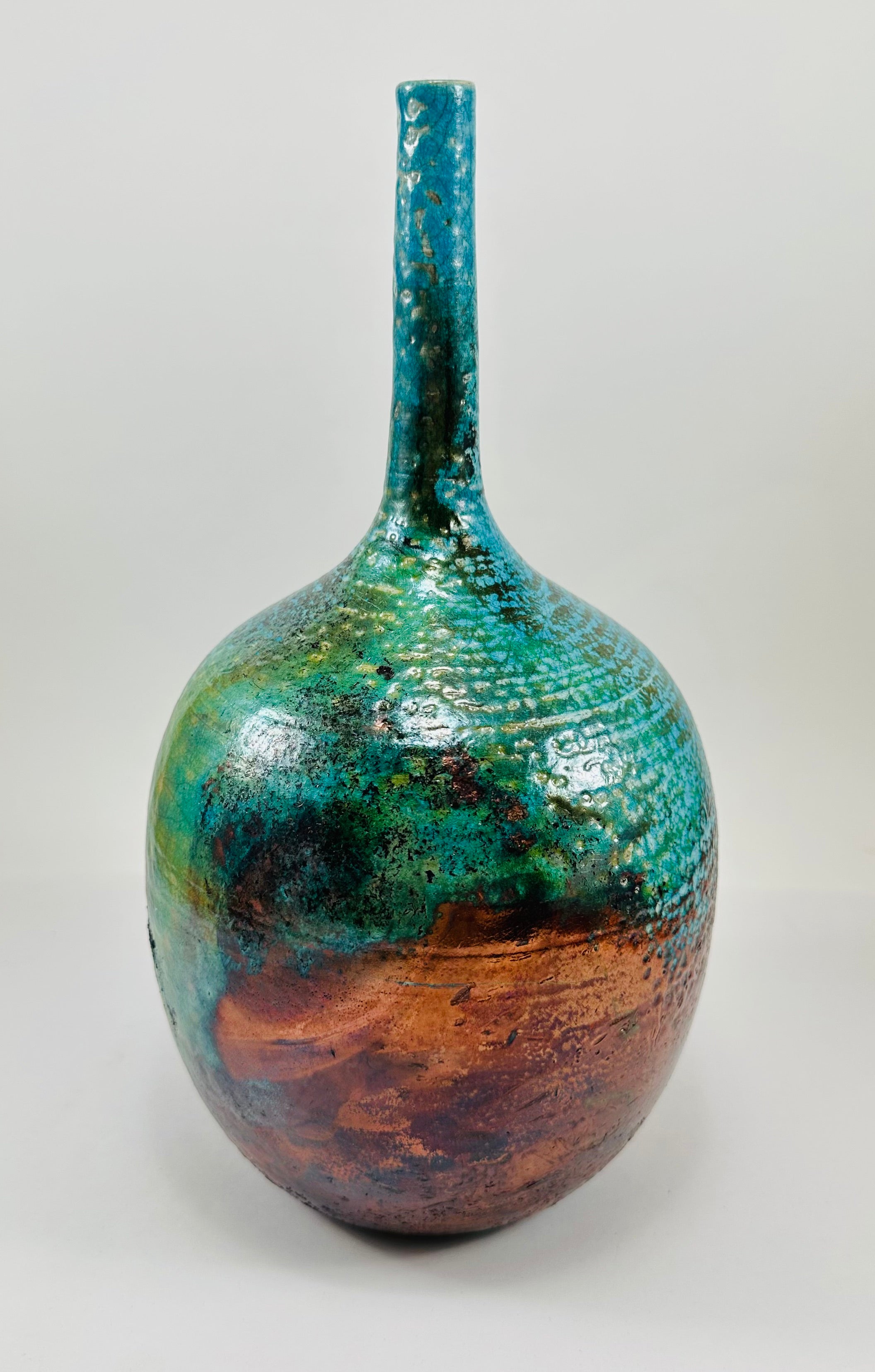 Handmade Raku vase in a beautiful turquoise and copper glaze.