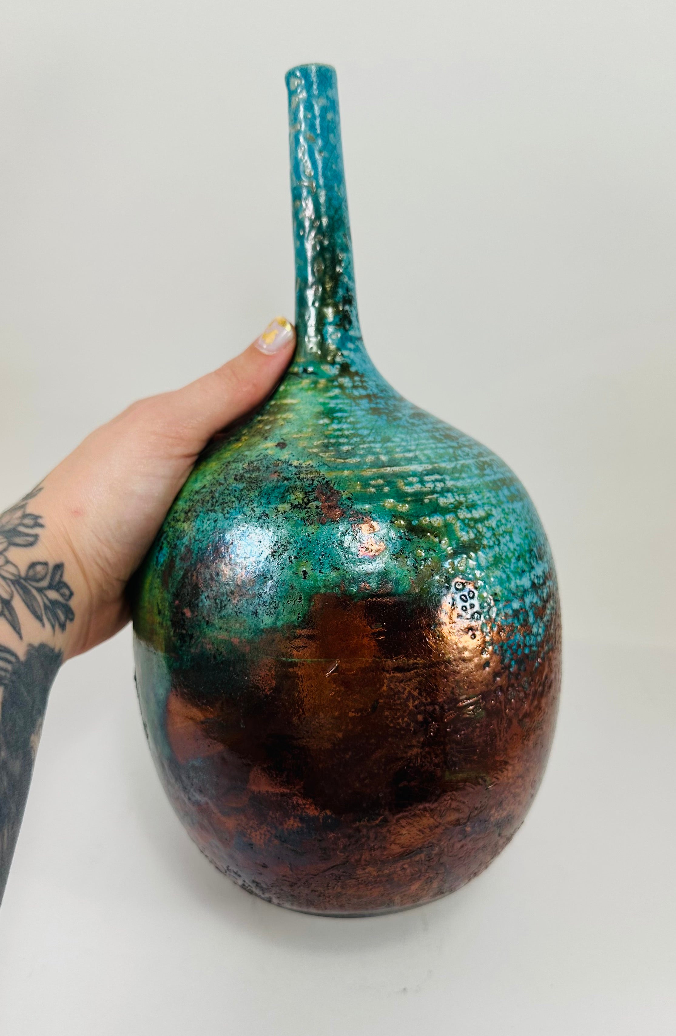 Handmade Raku vase in a beautiful turquoise and copper glaze.
