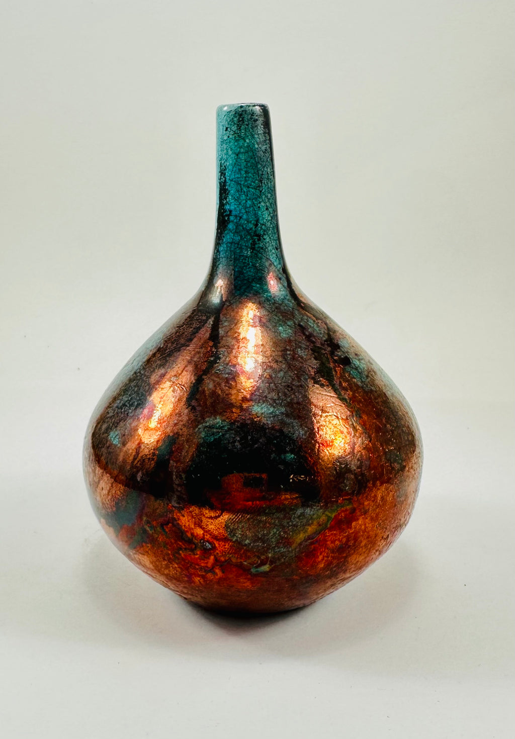 Handmade Raku vase in a beautiful turquoise and copper glaze.