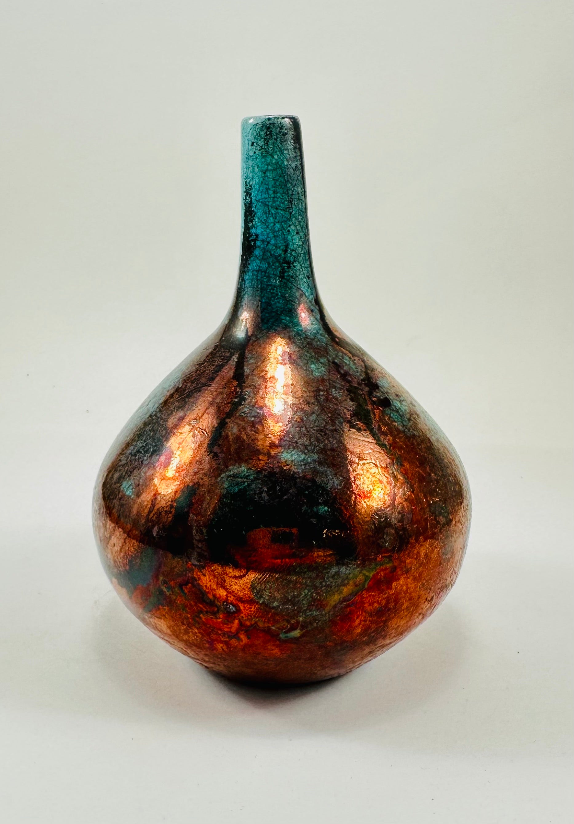 Handmade Raku vase in a beautiful turquoise and copper glaze.