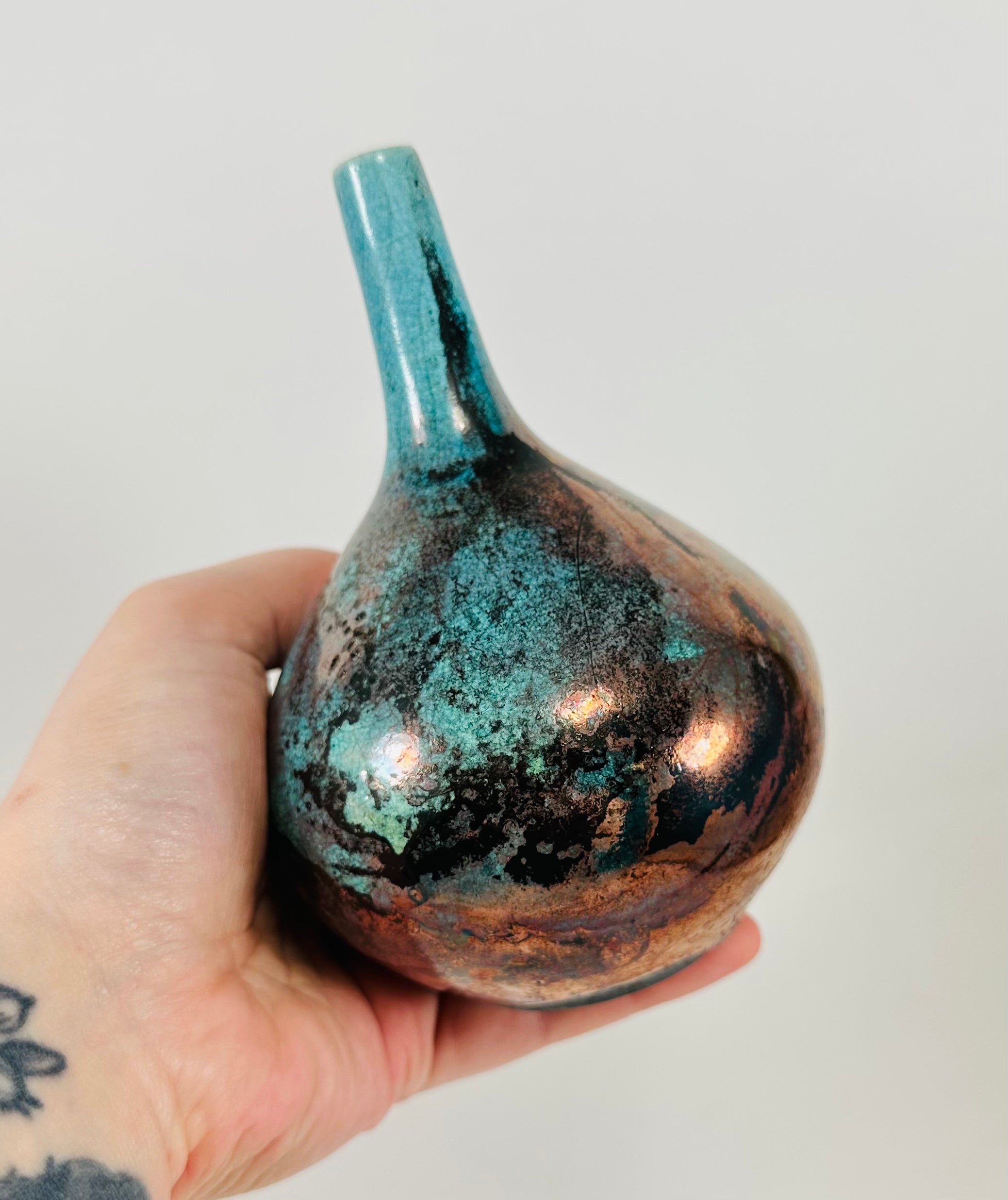 Handmade Raku vase in a beautiful turquoise and copper glaze.