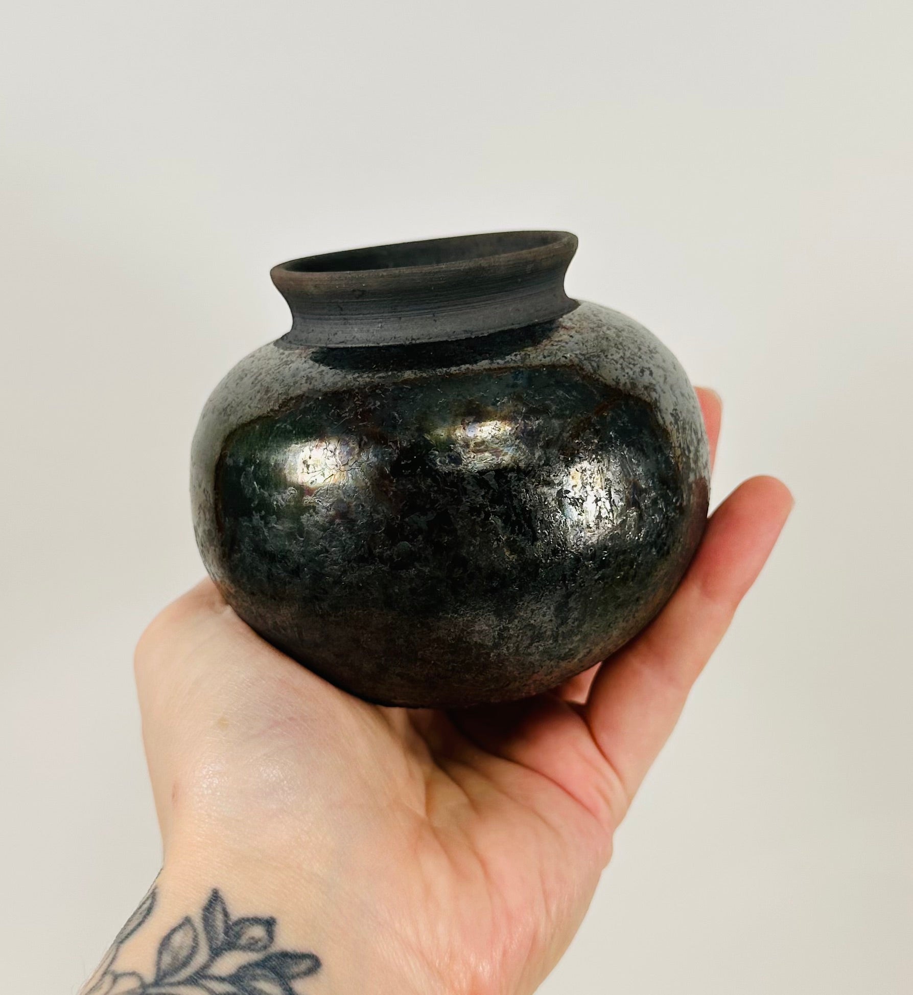 Handmade Raku vase in a beautiful black metallic glaze.