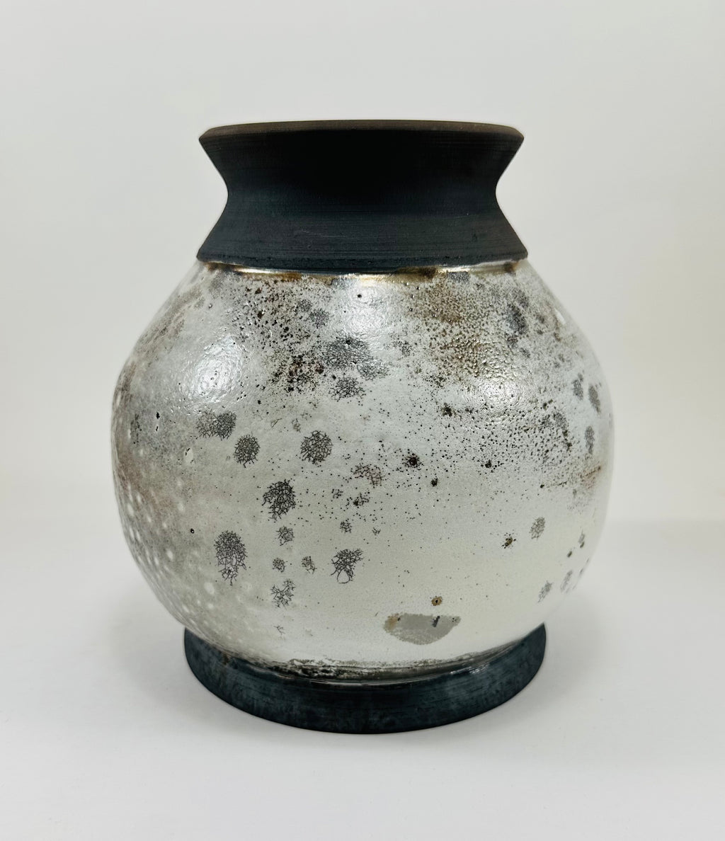 Handmade raku vase in a beautiful white and black crackle glaze.
