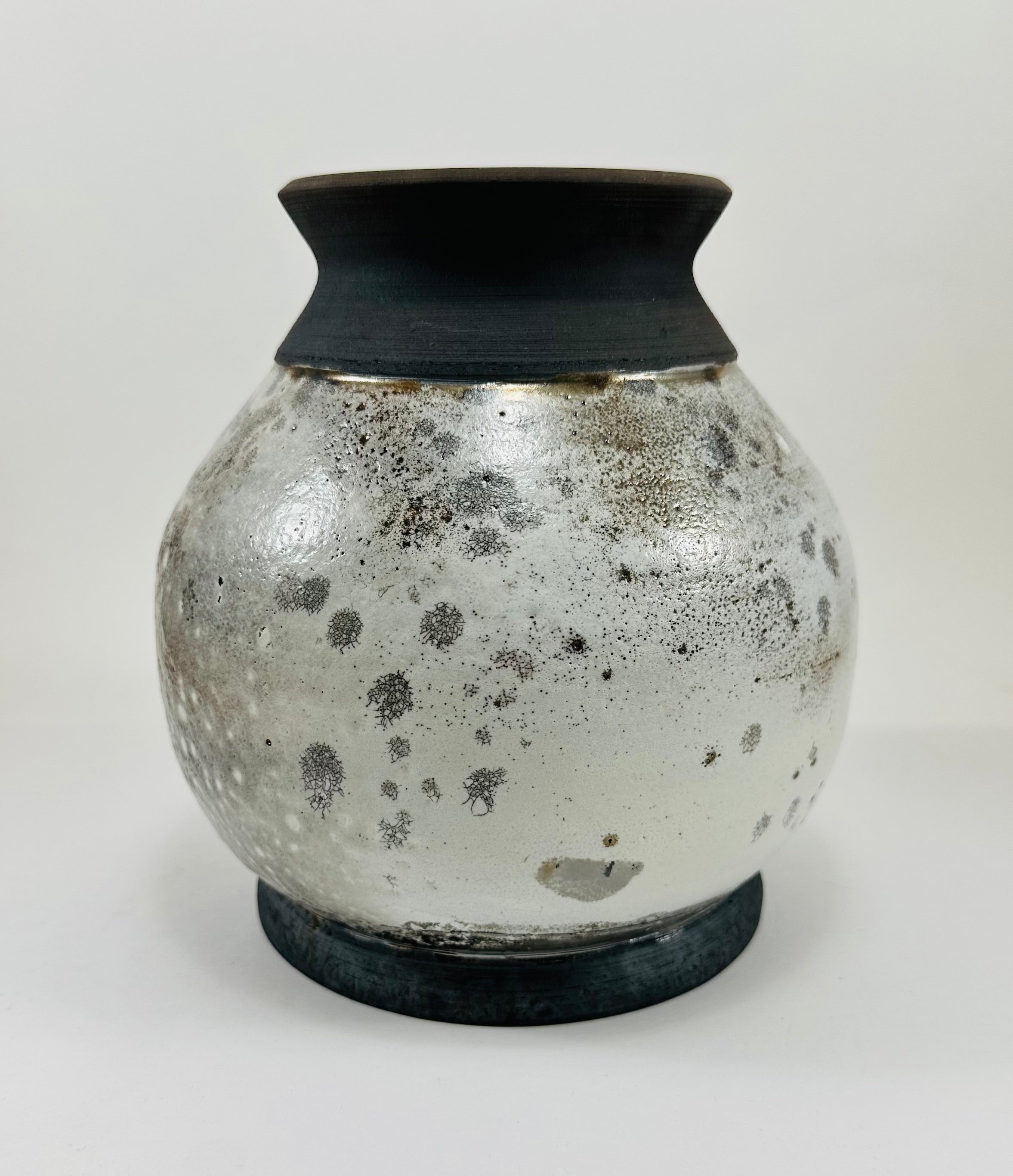 Handmade raku vase in a beautiful white and black crackle glaze.