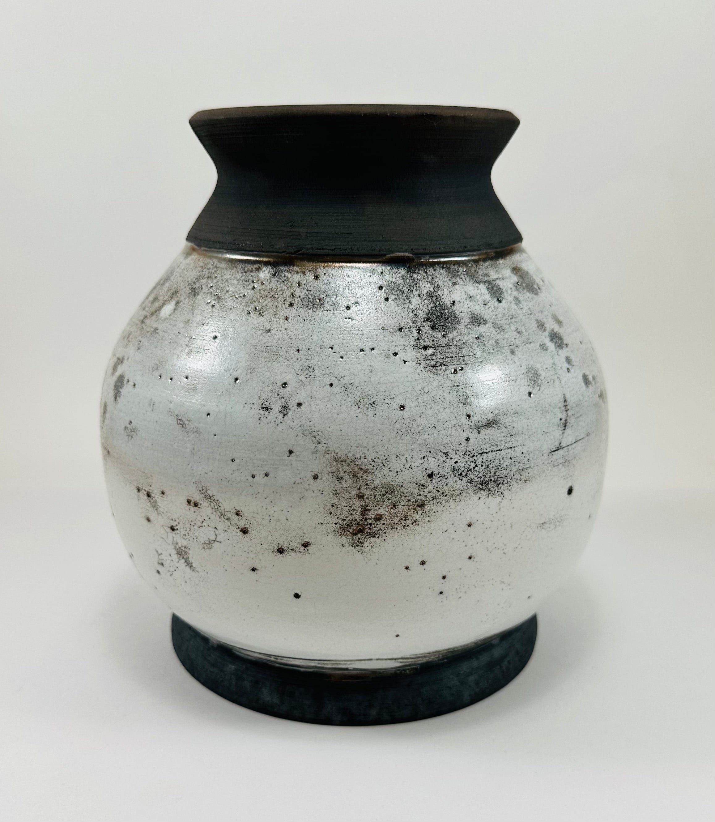 Handmade raku vase in a beautiful white and black crackle glaze.