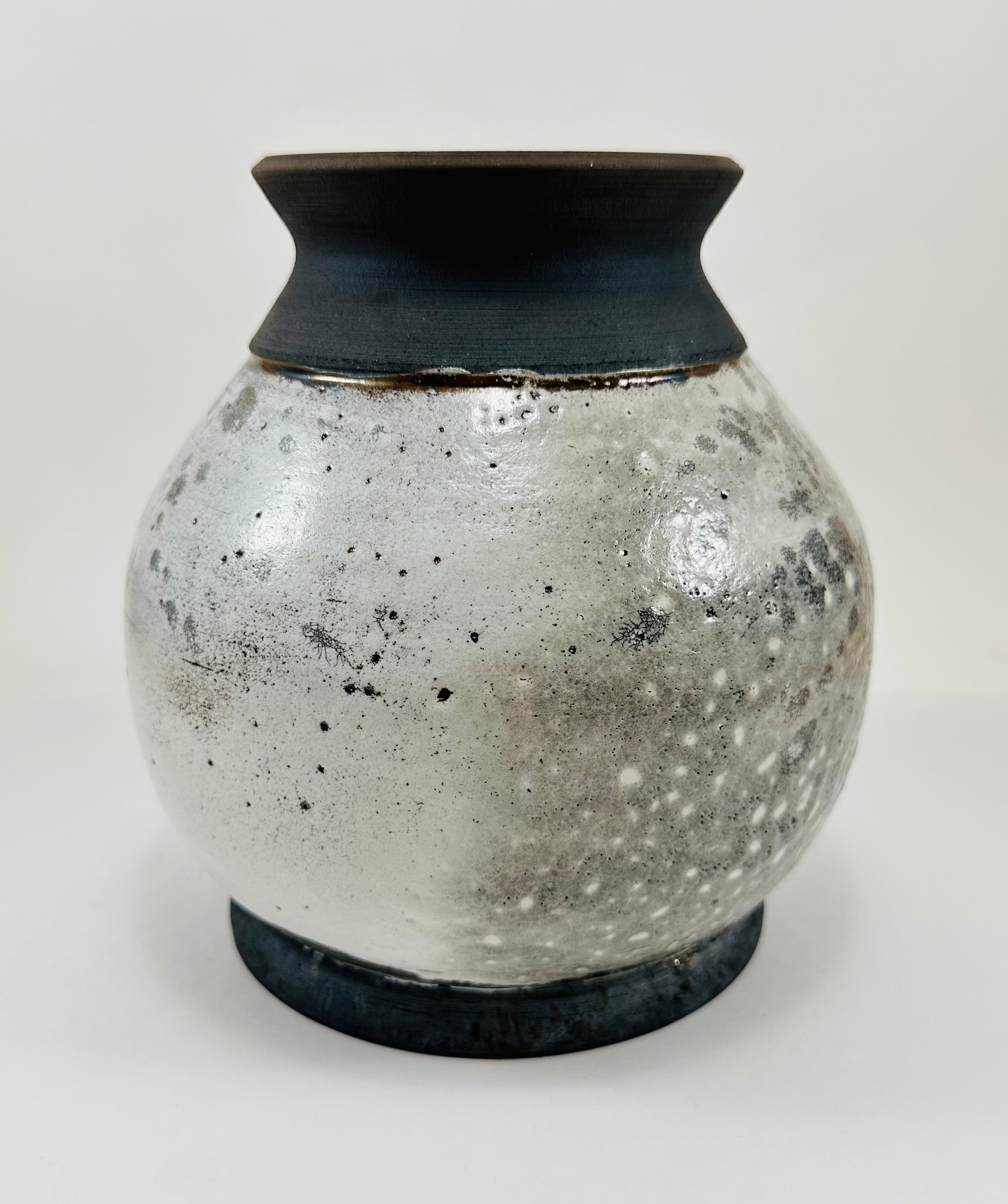 Handmade raku vase in a beautiful white and black crackle glaze.