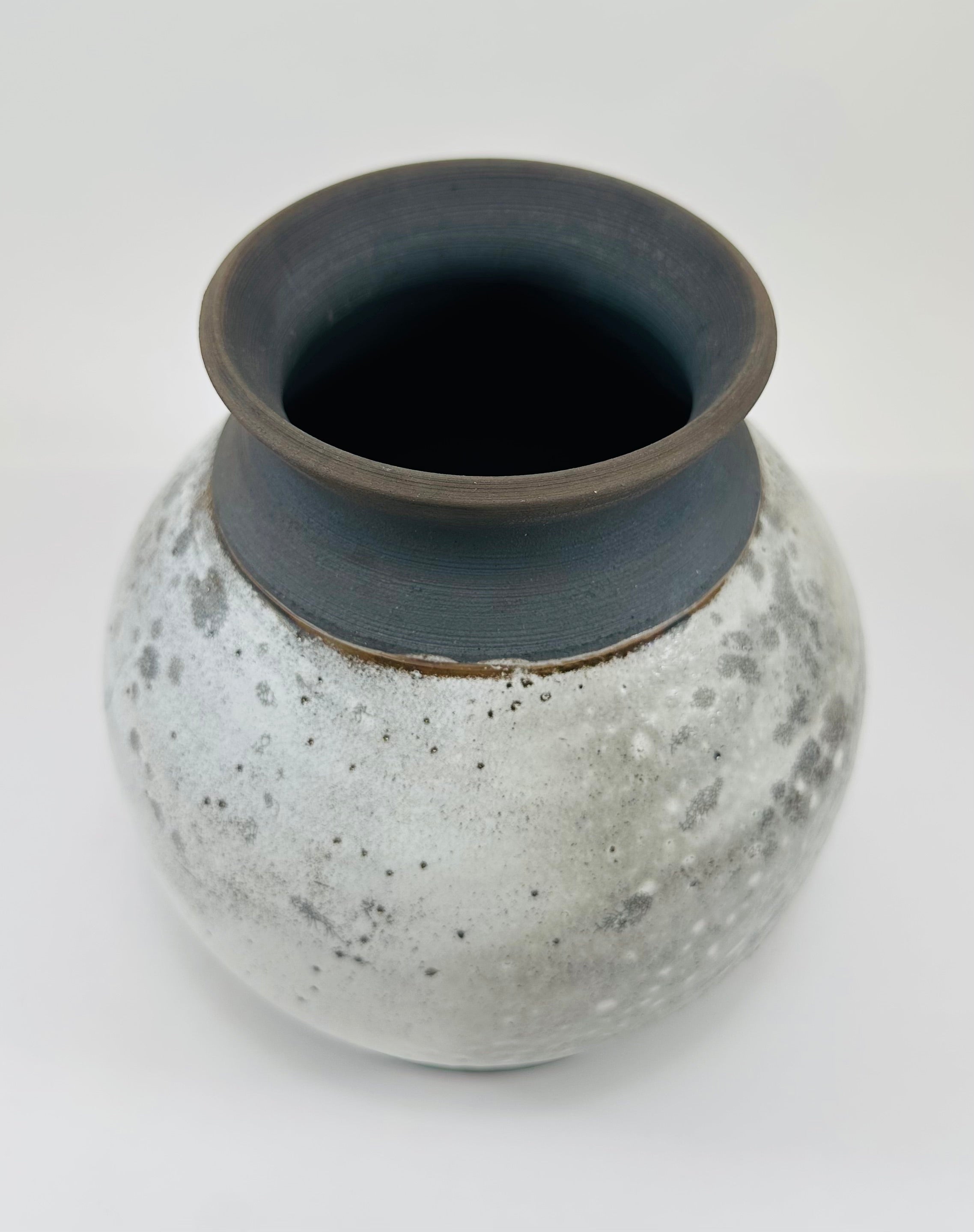 Handmade raku vase in a beautiful white and black crackle glaze.