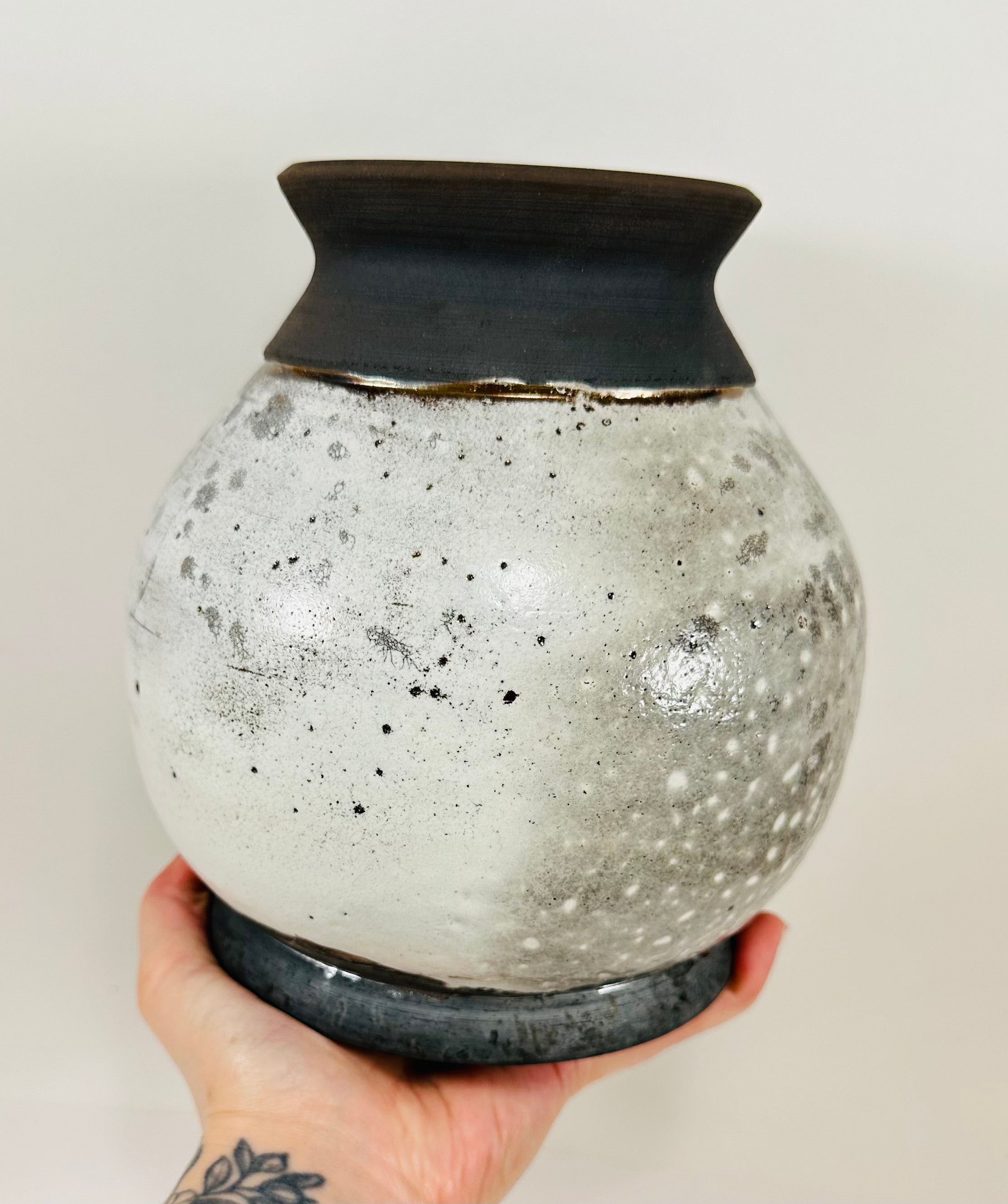 Handmade raku vase in a beautiful white and black crackle glaze.