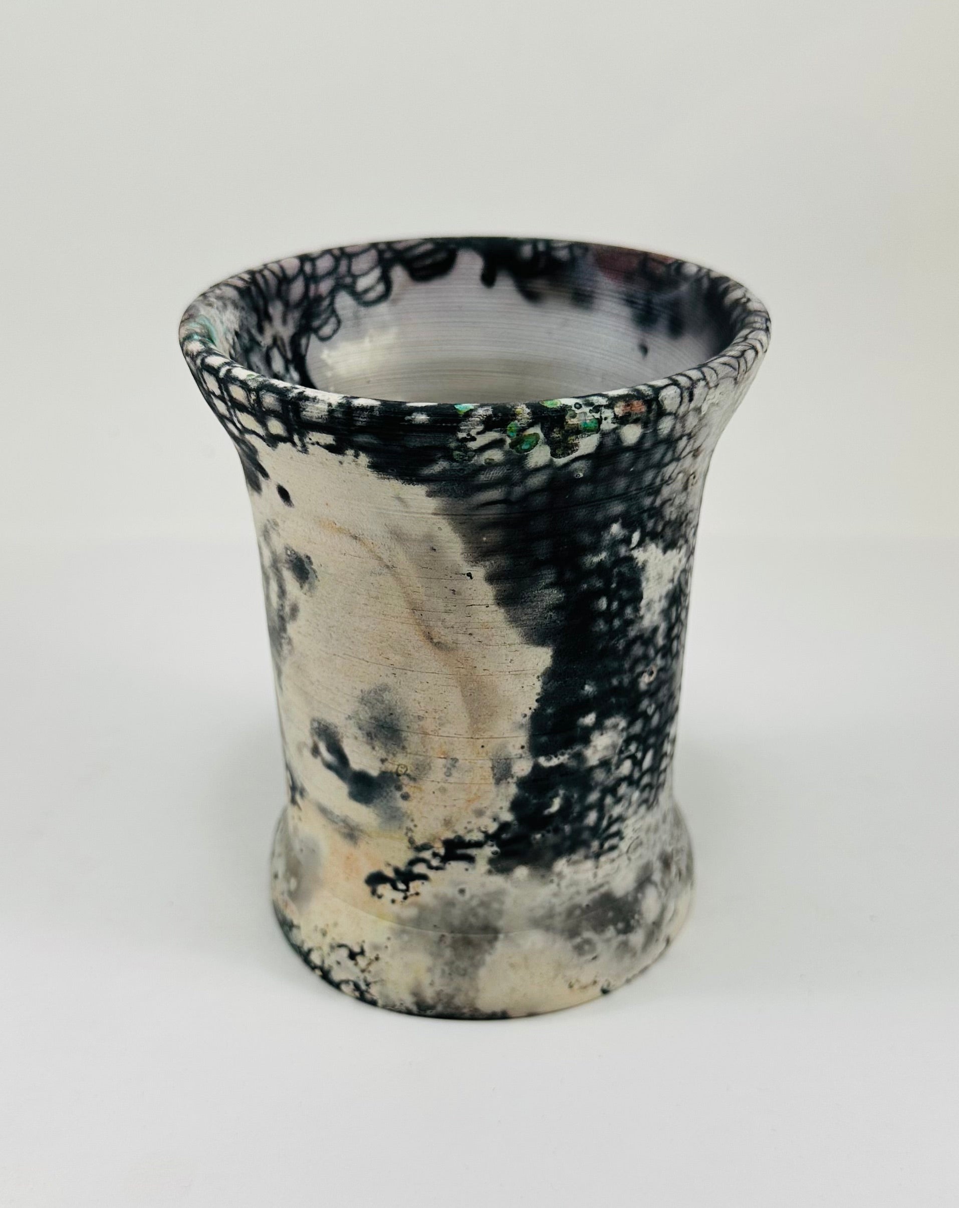 Handmade vase with a brown, white, black, red, blue and yellow smokey finish.