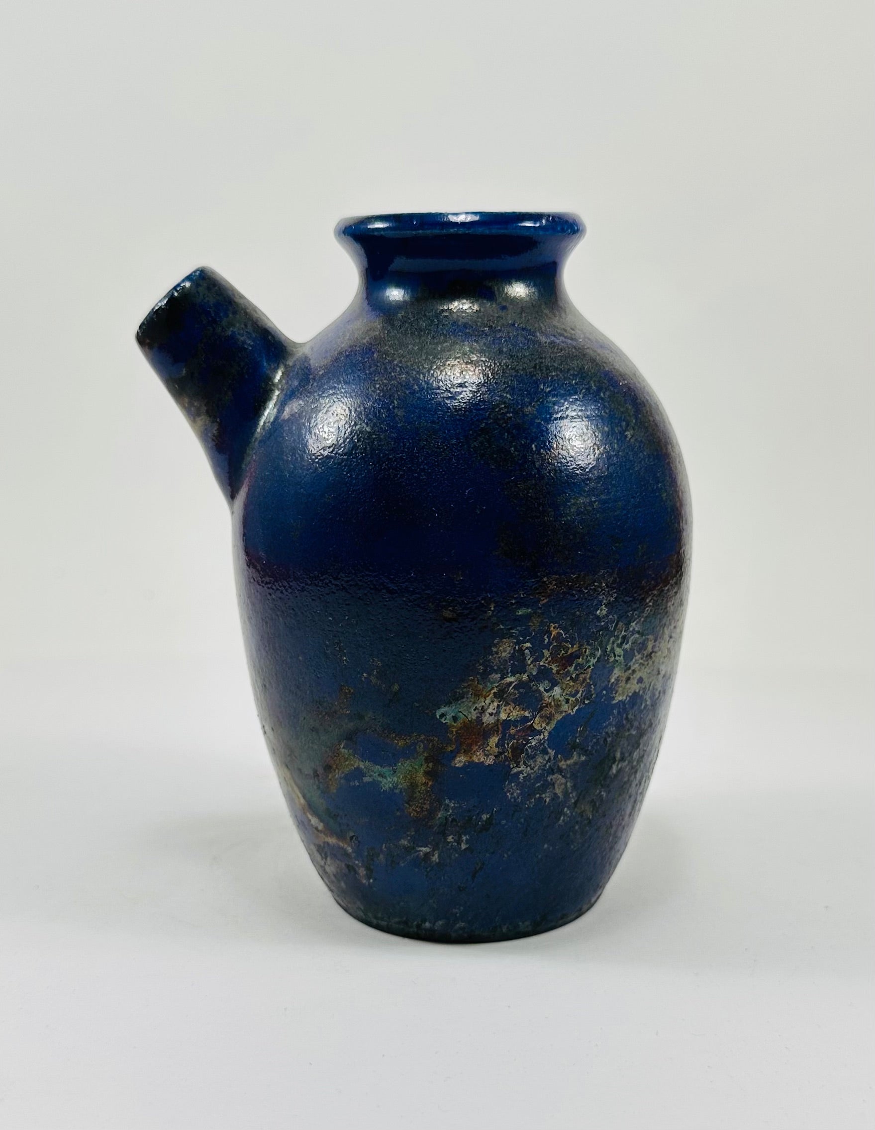 Handmade raku vase in a beautiful purple and black glaze.