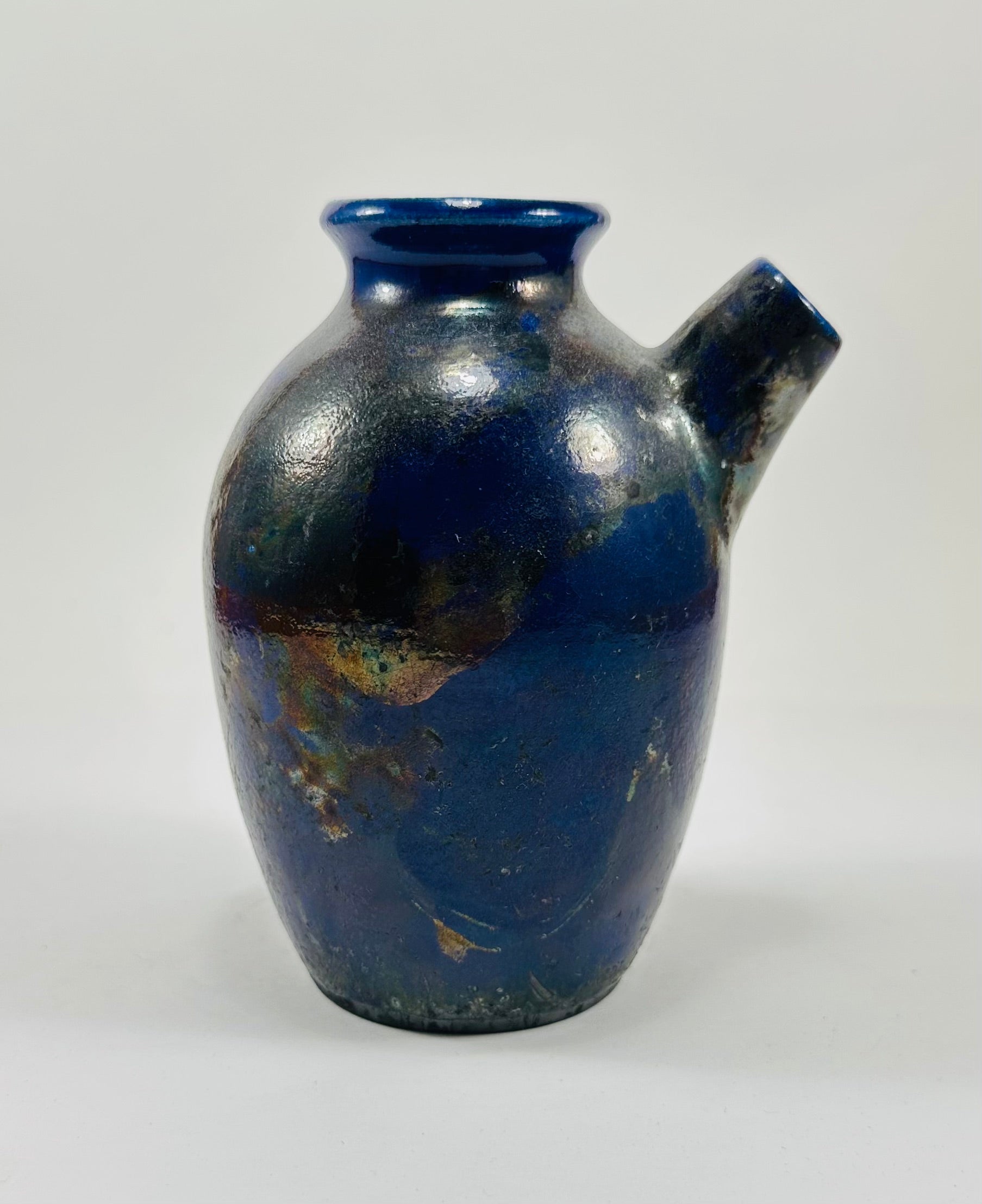 Handmade raku vase in a beautiful purple and black glaze.