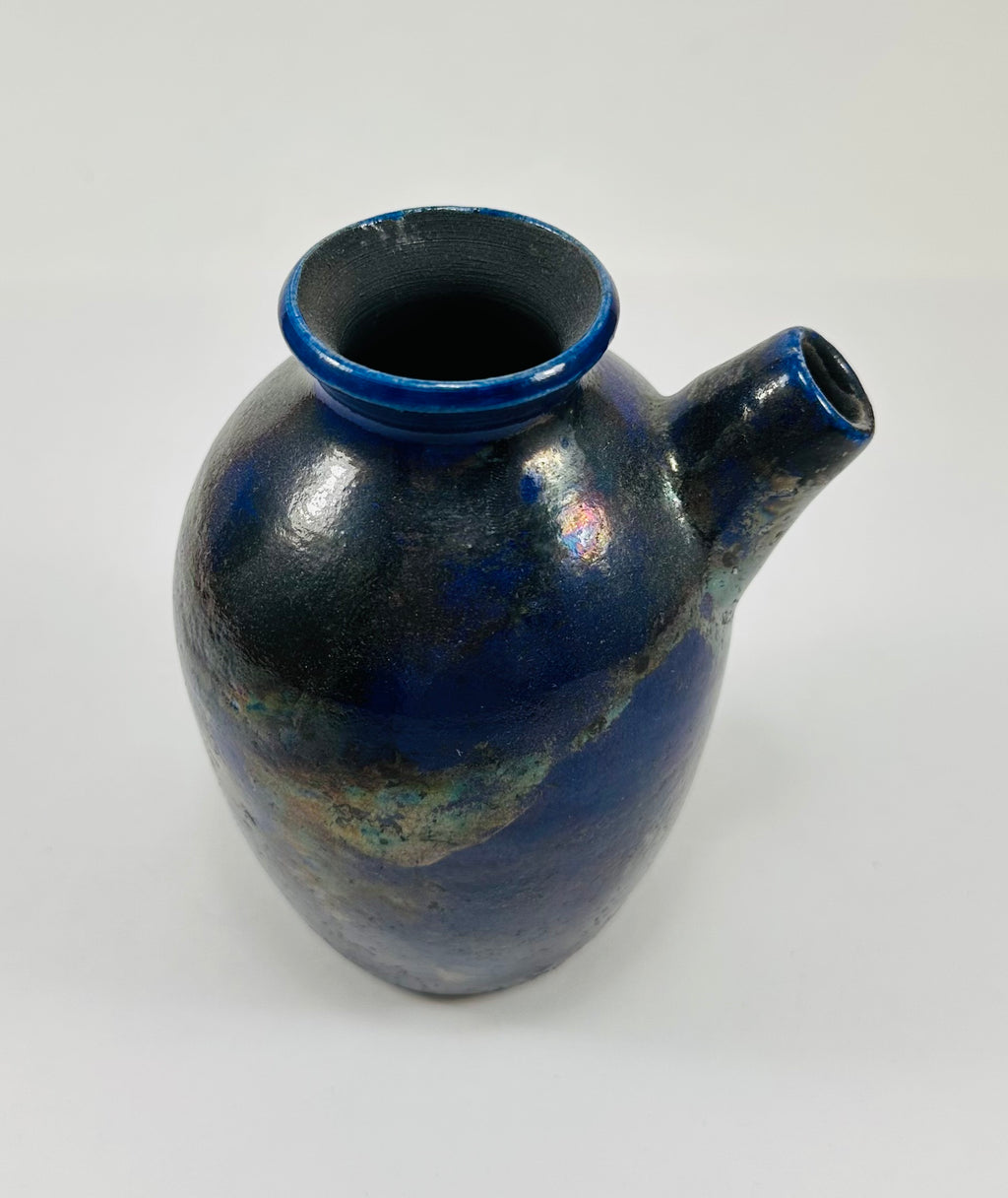 Handmade raku vase in a beautiful purple and black glaze.