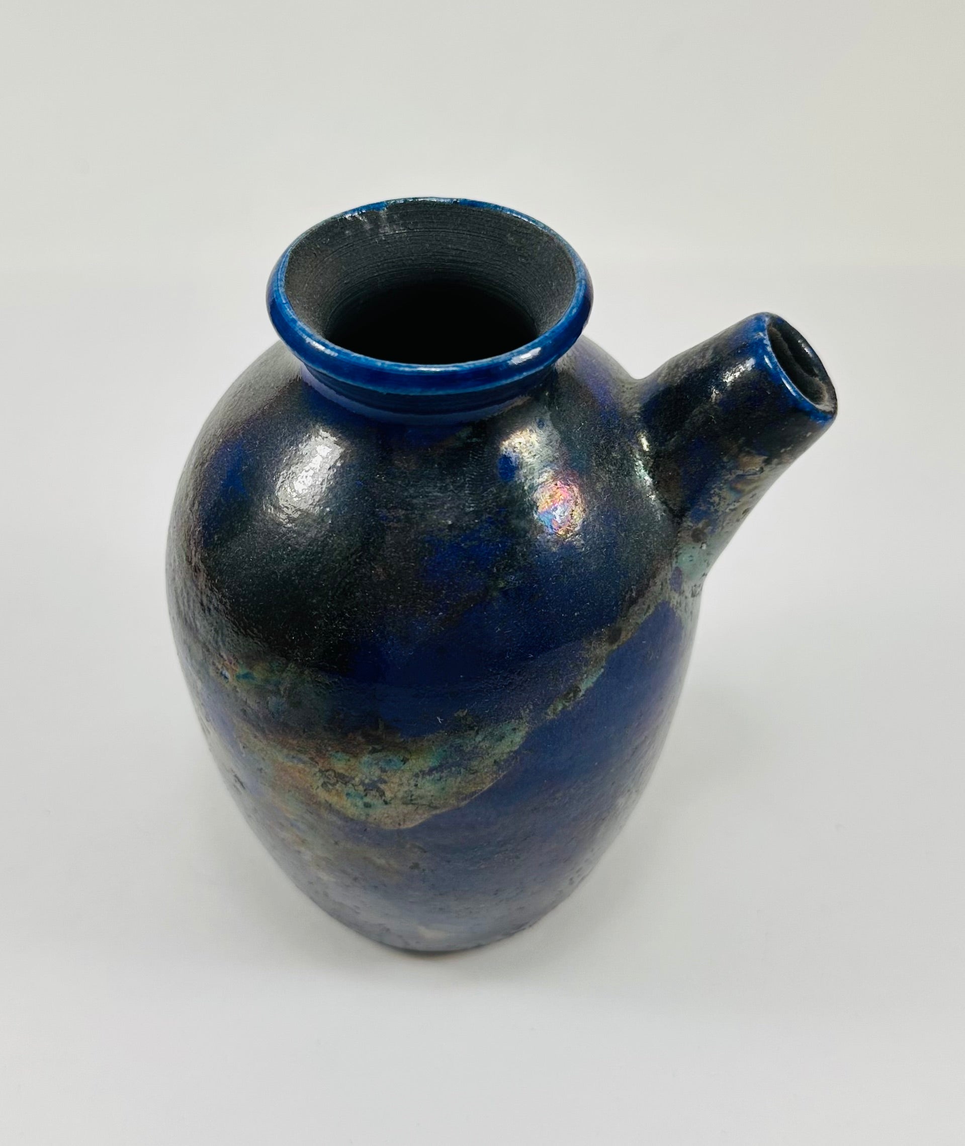 Handmade raku vase in a beautiful purple and black glaze.