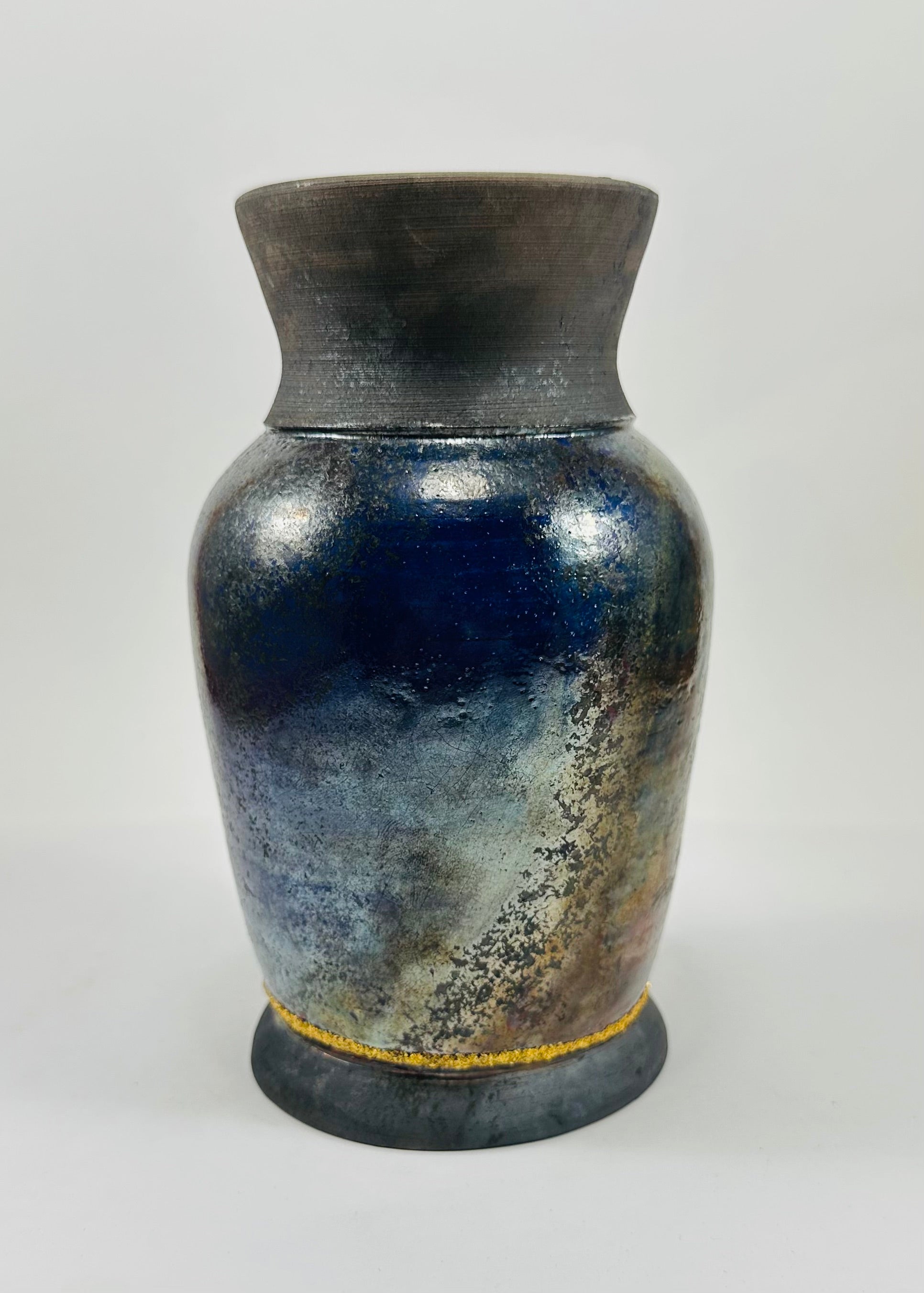 Handmade raku vase in a beautiful blue and black glaze.