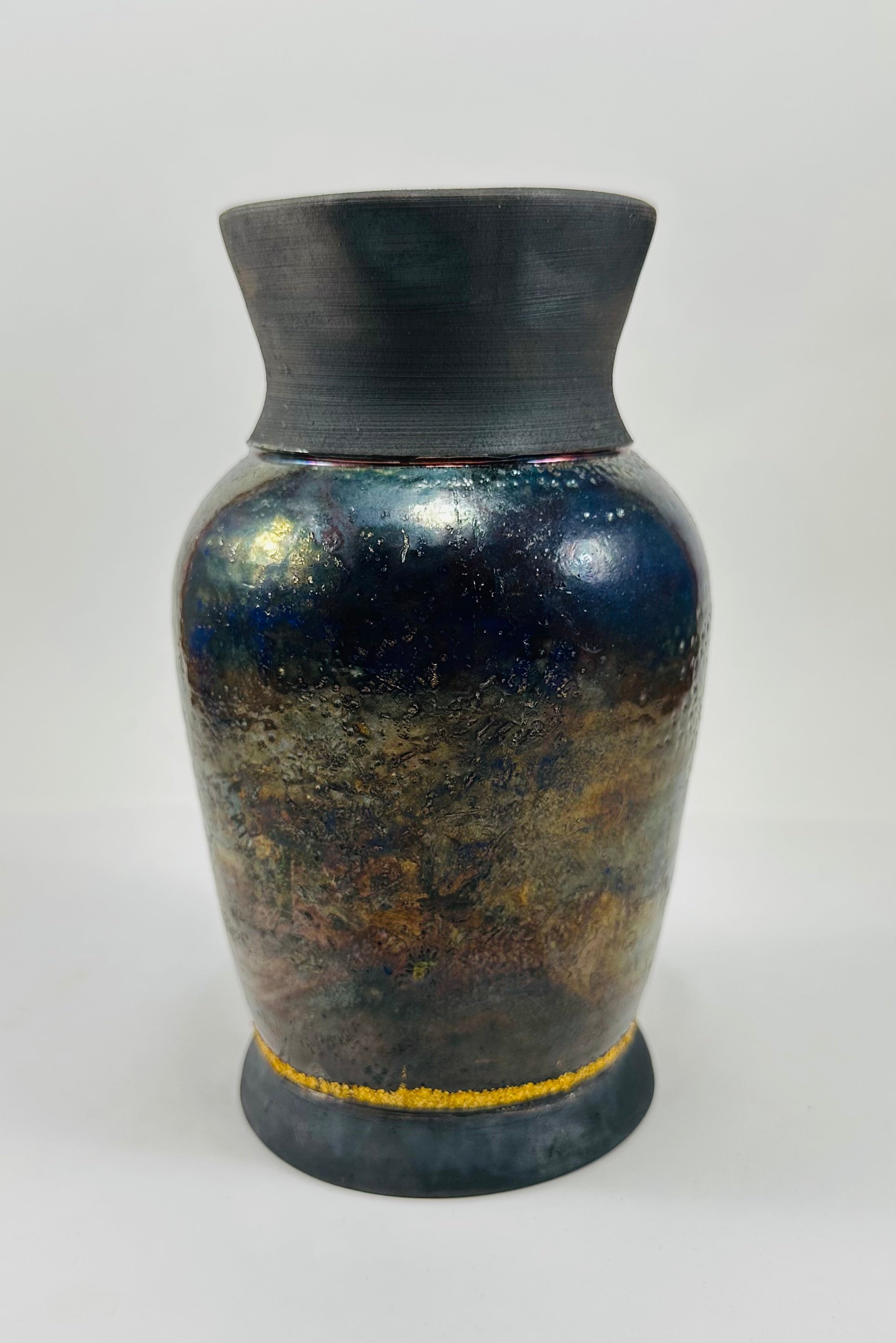 Handmade raku vase in a beautiful blue and black glaze.
