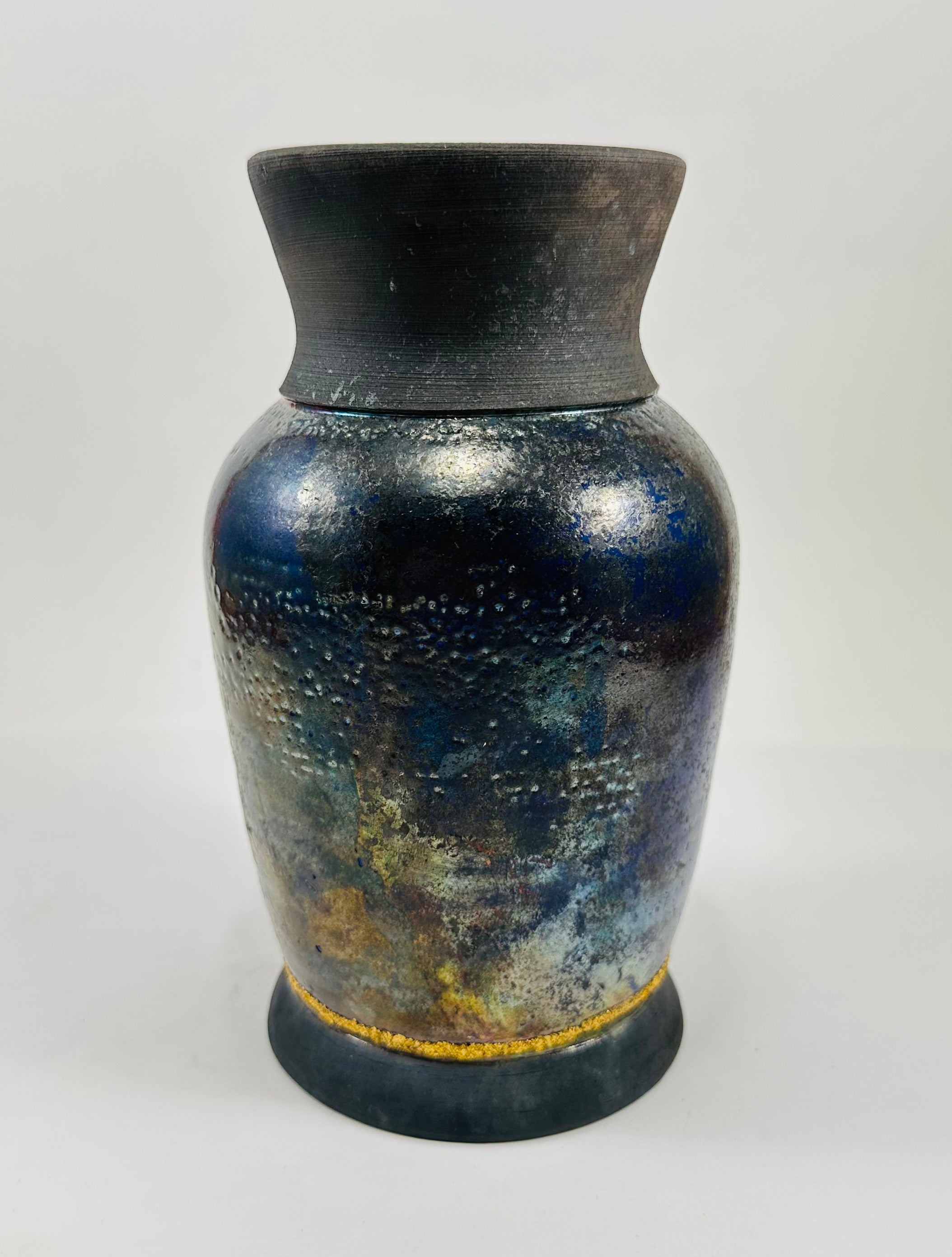 Handmade raku vase in a beautiful blue and black glaze.