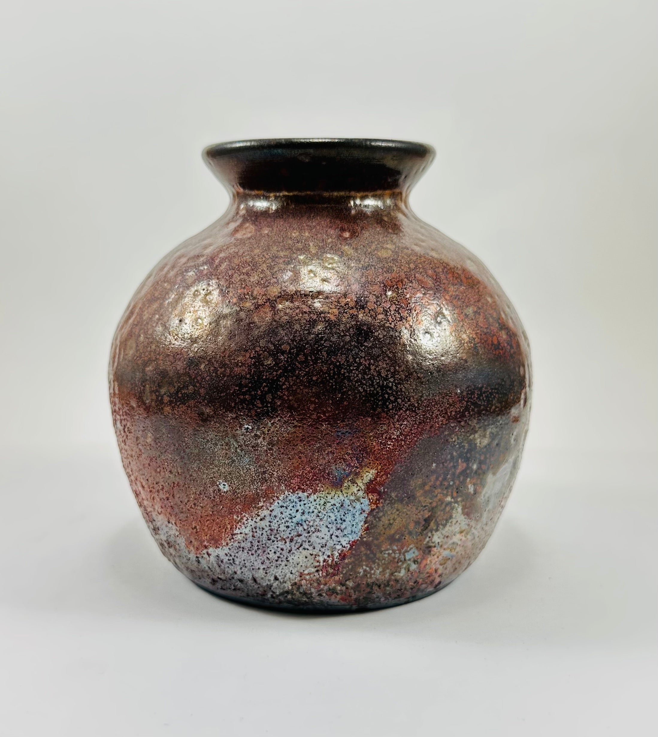 Handmade raku vase in a beautiful red and black glaze.