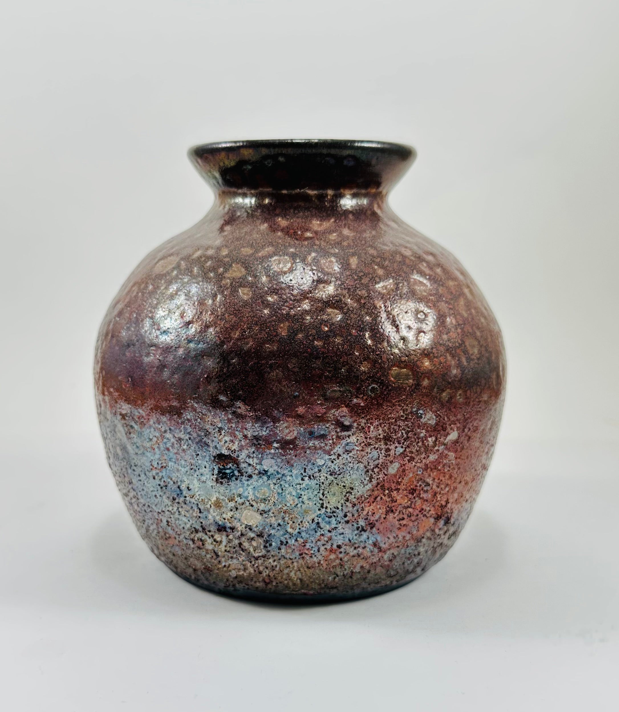 Handmade raku vase in a beautiful red and black glaze.