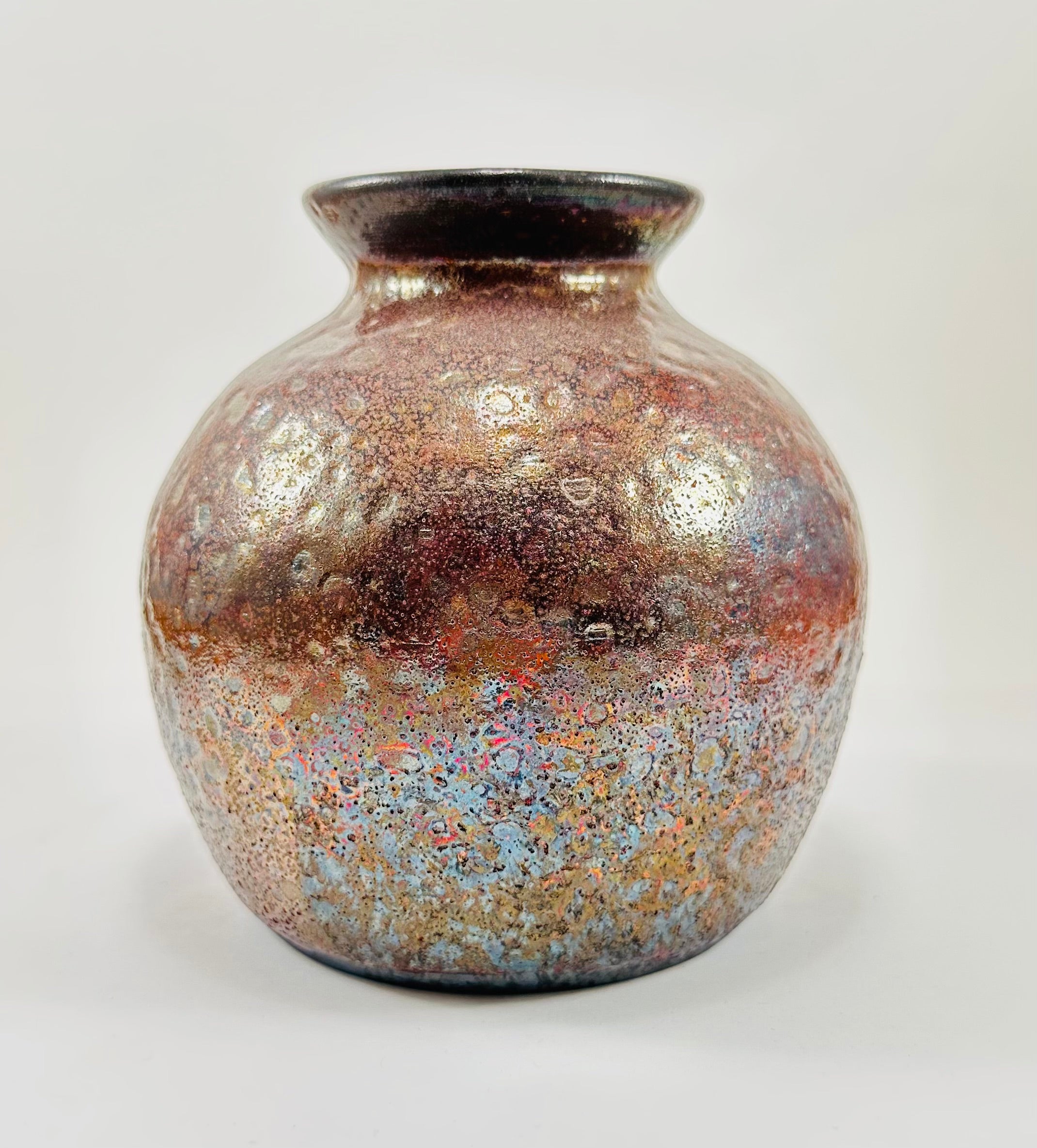 Handmade raku vase in a beautiful red and black glaze.