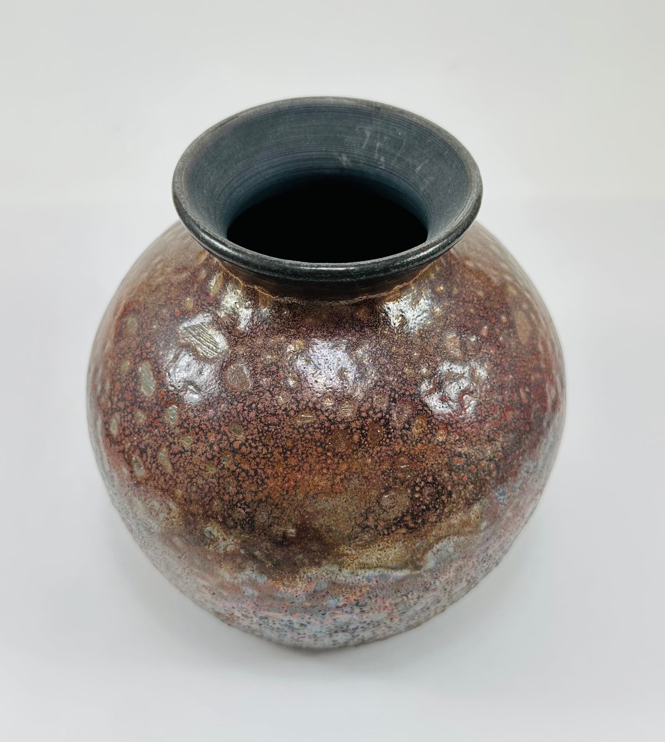 Handmade raku vase in a beautiful red and black glaze.