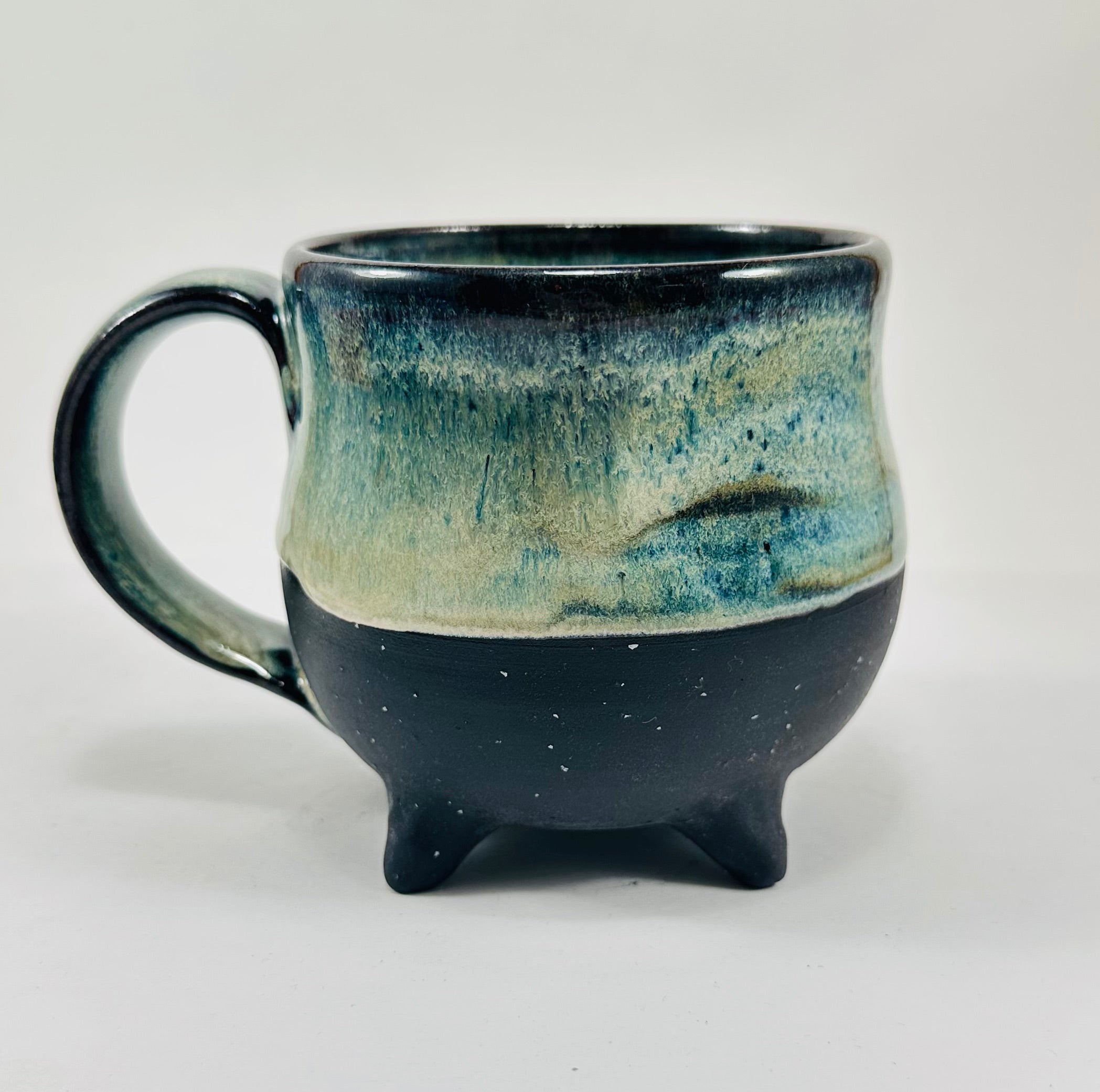 Handmade ceramic cauldron mug in a beautiful blue/green glaze