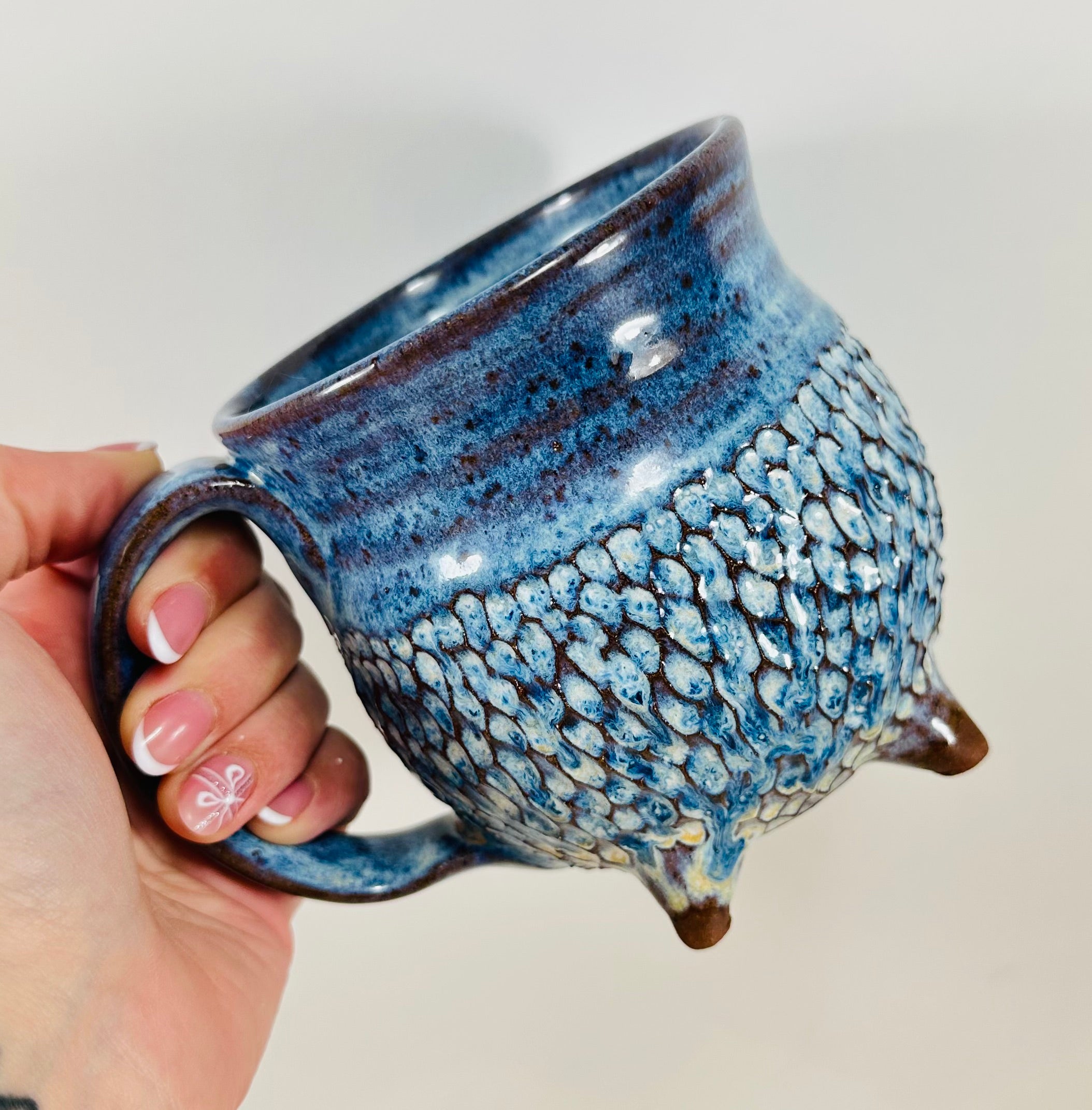 Handmade ceramic cauldron mug in a beautiful blue glaze