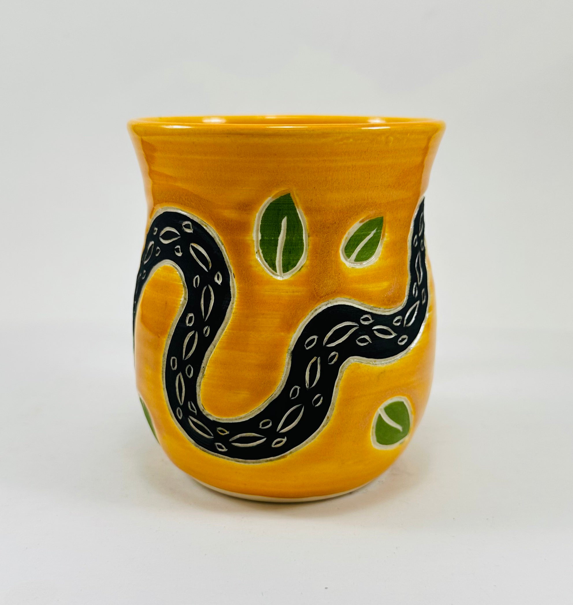 handmade ceramic mug in a beautiful yellow glaze with a snake on it