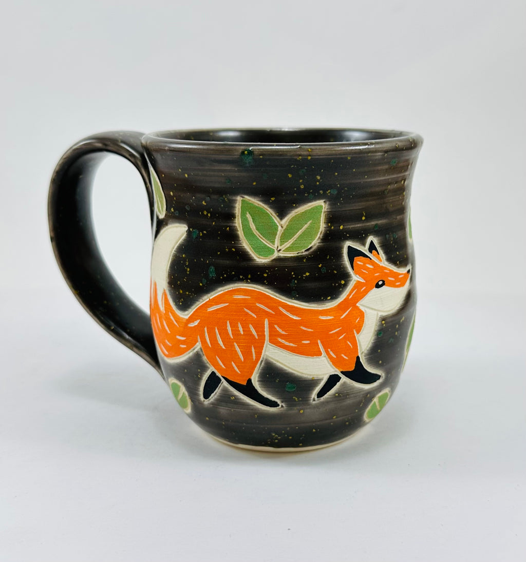 handmade ceramic mug in a beautiful brown glaze and a fox illustration on it