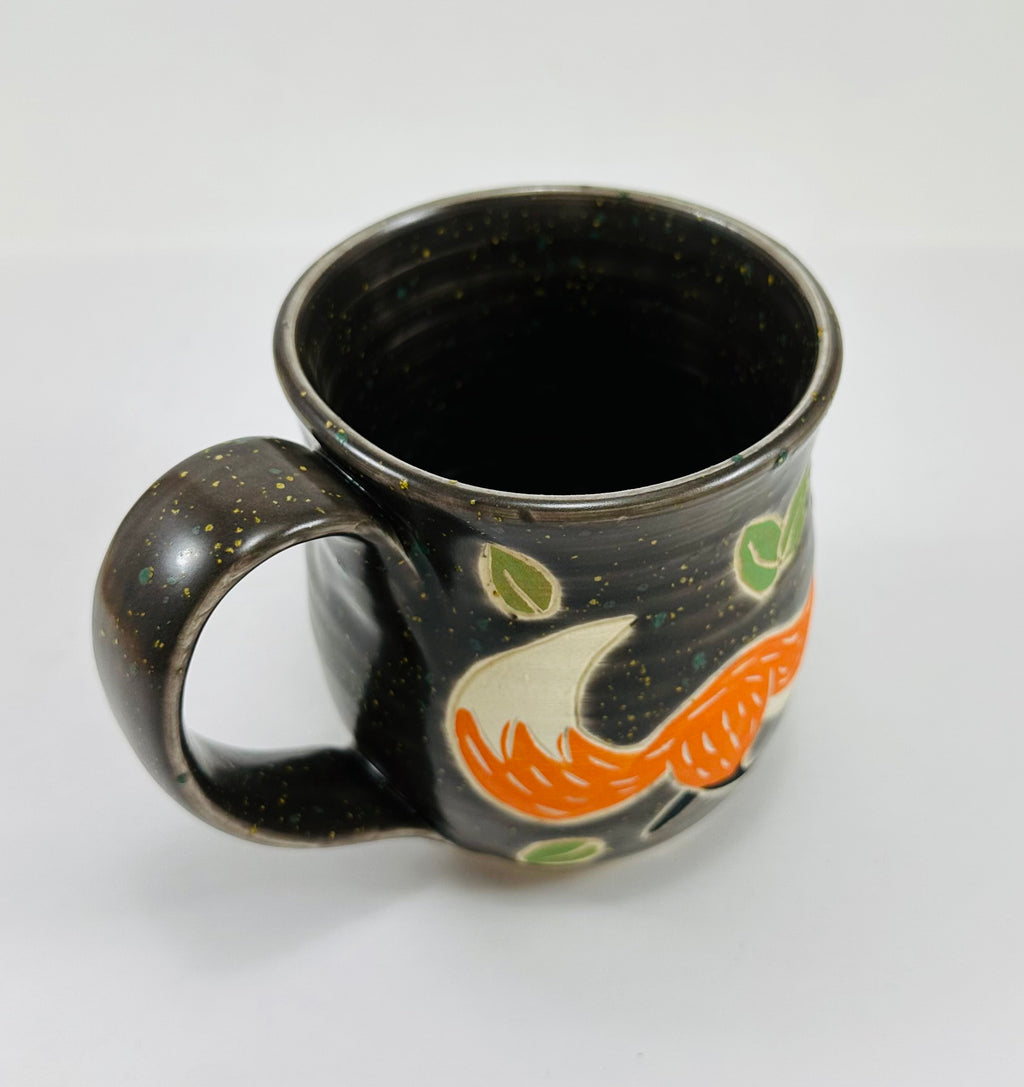 handmade ceramic mug in a beautiful brown glaze and a fox illustration on it
