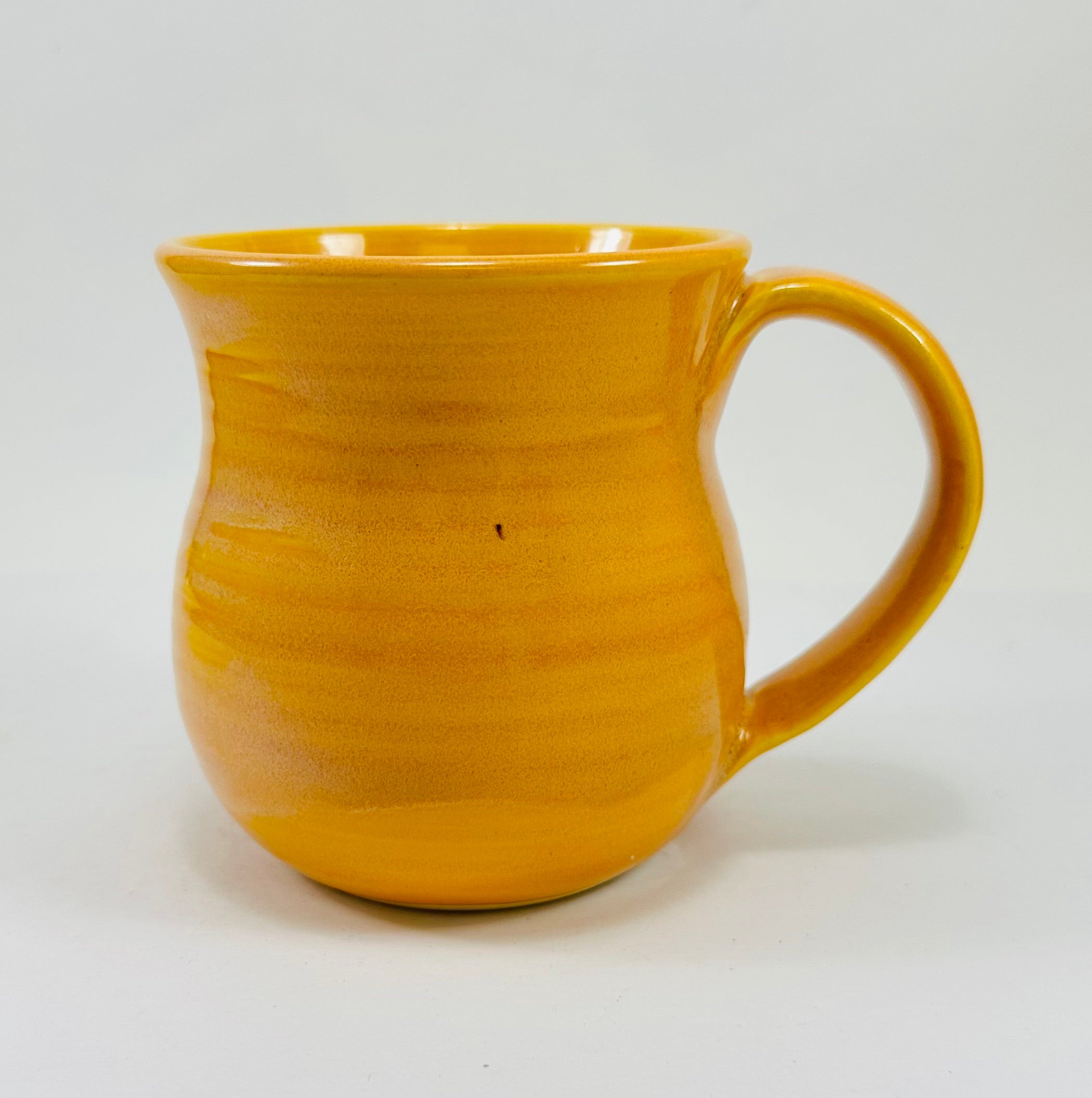 handmade ceramic mug in a beautiful yellow glaze and a luna moth illustration on it.