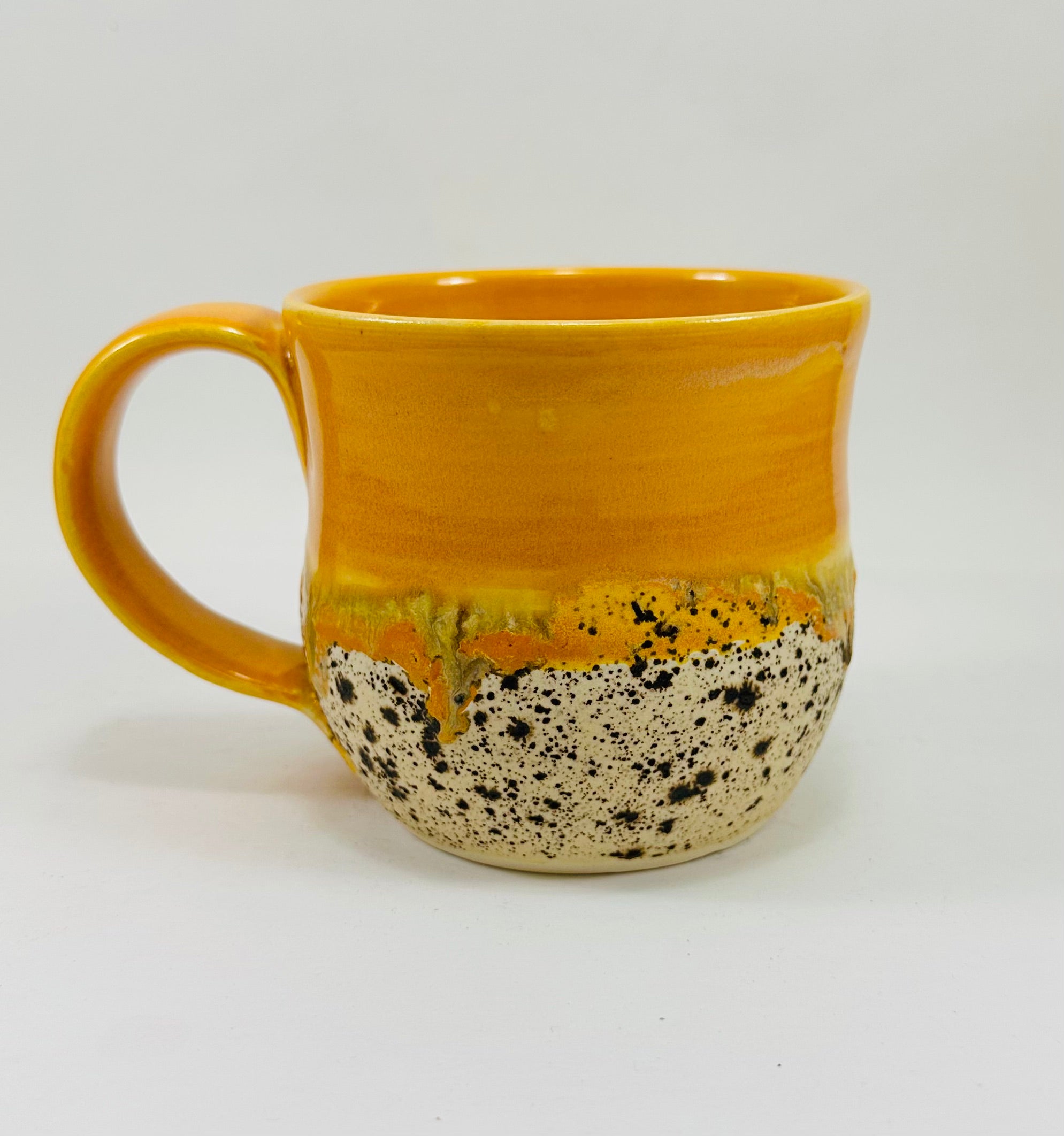 handmade ceramic mug in a beautiful orange and brown glaze