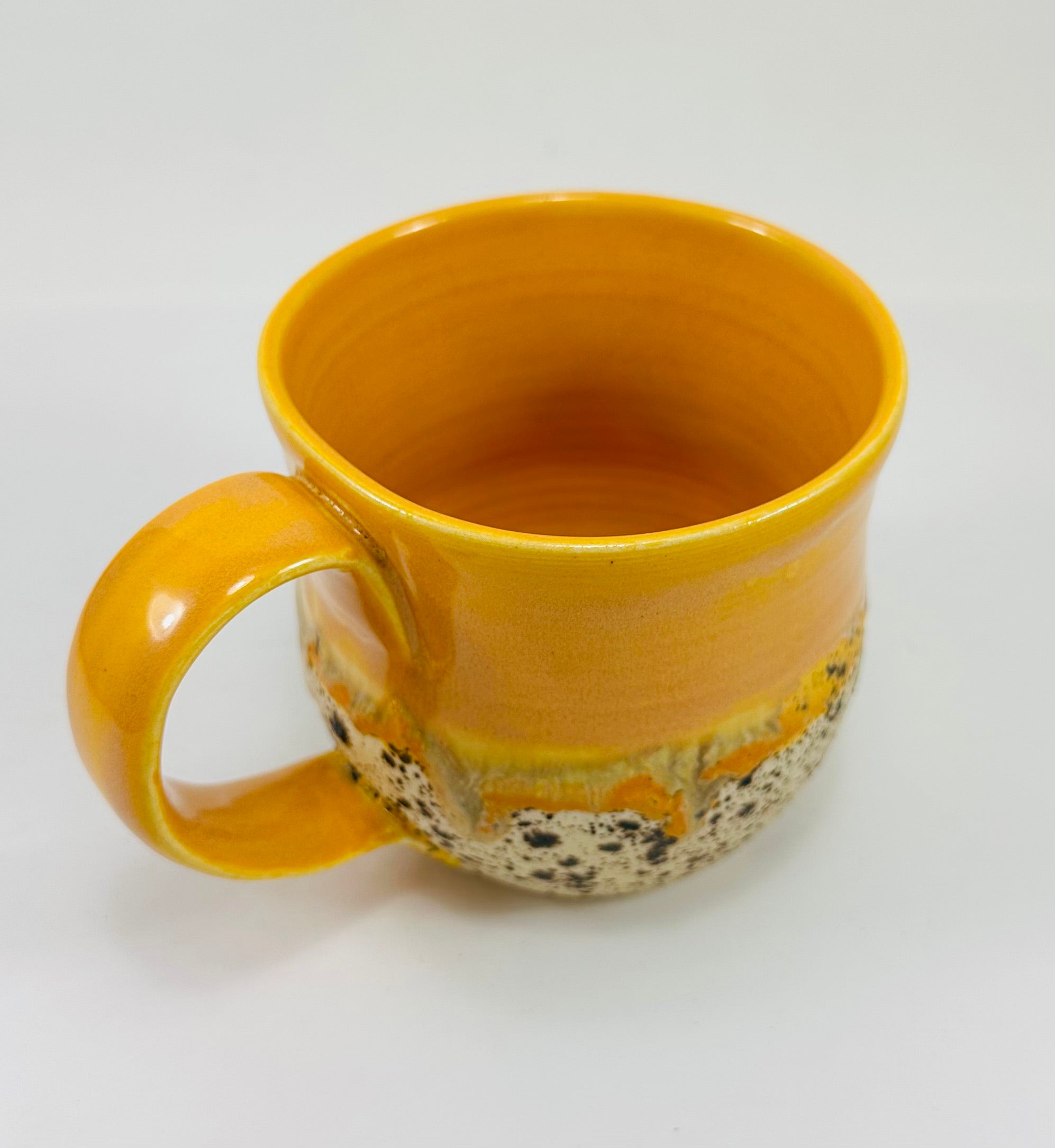 handmade ceramic mug in a beautiful orange and brown glaze