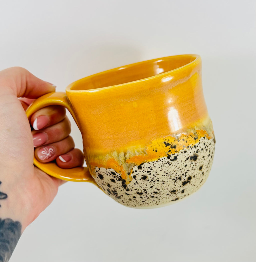 handmade ceramic mug in a beautiful orange and brown glaze