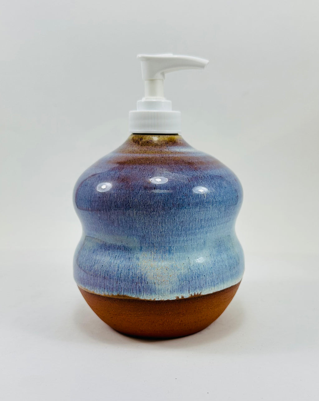 handmade ceramic soap dispenser in a beautiful blue glaze