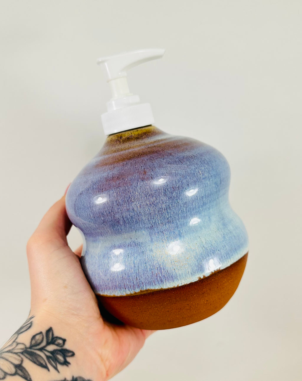 handmade ceramic soap dispenser in a beautiful blue glaze
