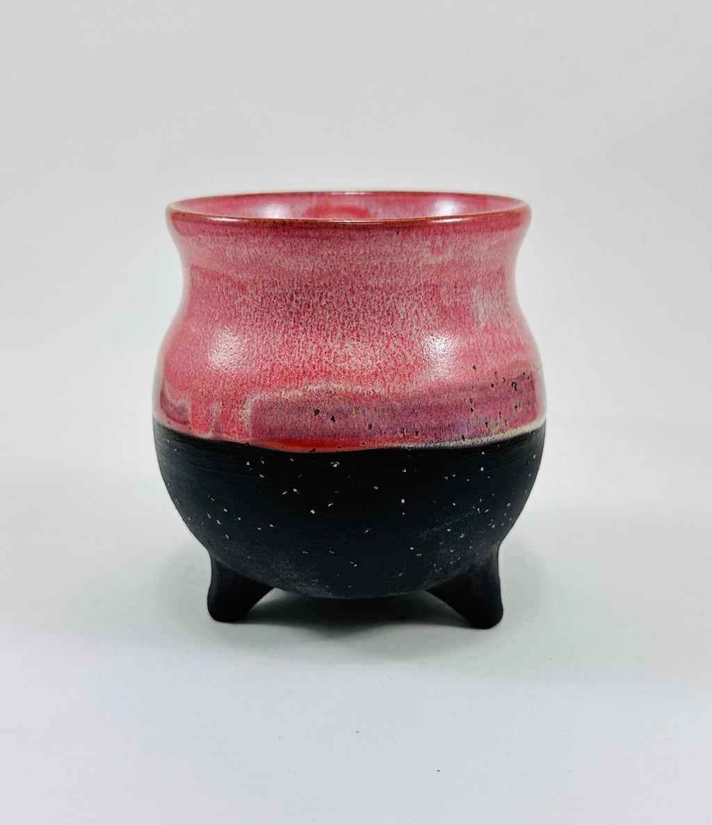 handmade ceramic cauldron in a beautiful pink and black glaze