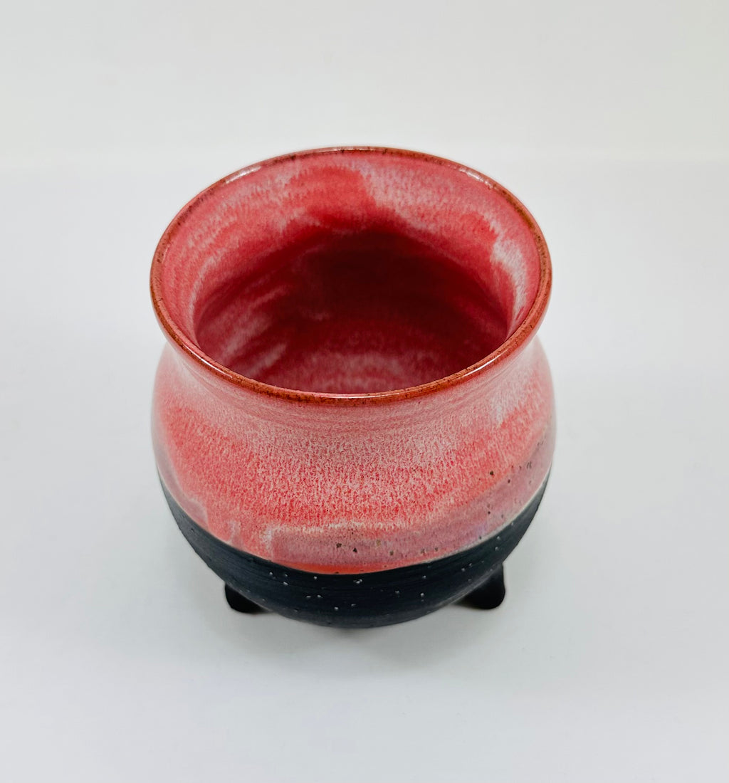 handmade ceramic cauldron in a beautiful pink and black glaze