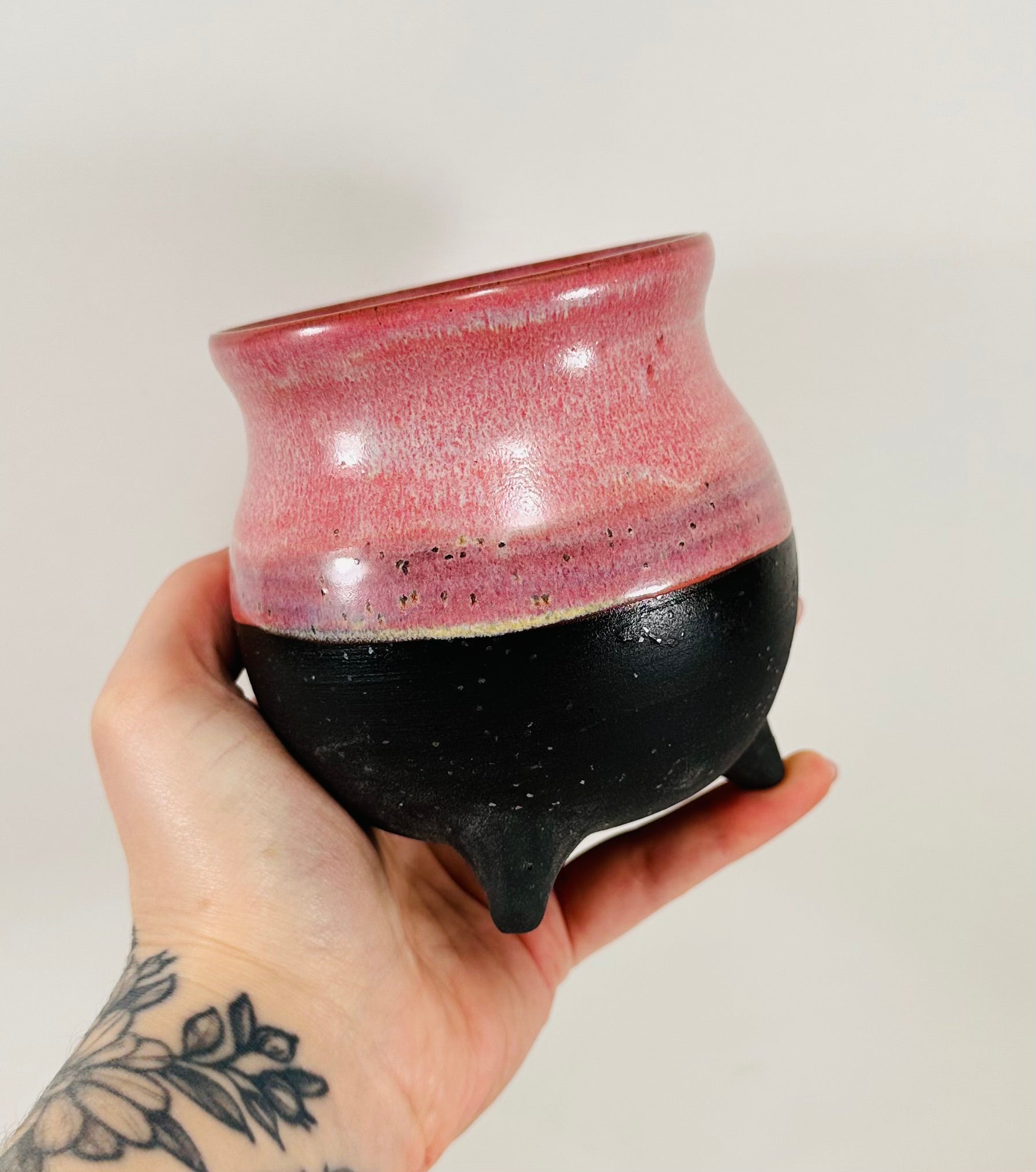 handmade ceramic cauldron in a beautiful pink and black glaze