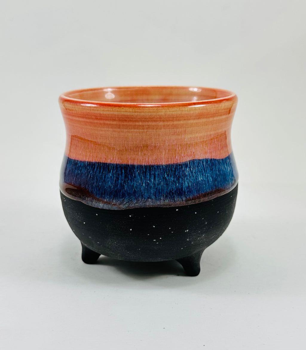 handmade ceramic cauldron in a beautiful peach, blue and black glaze