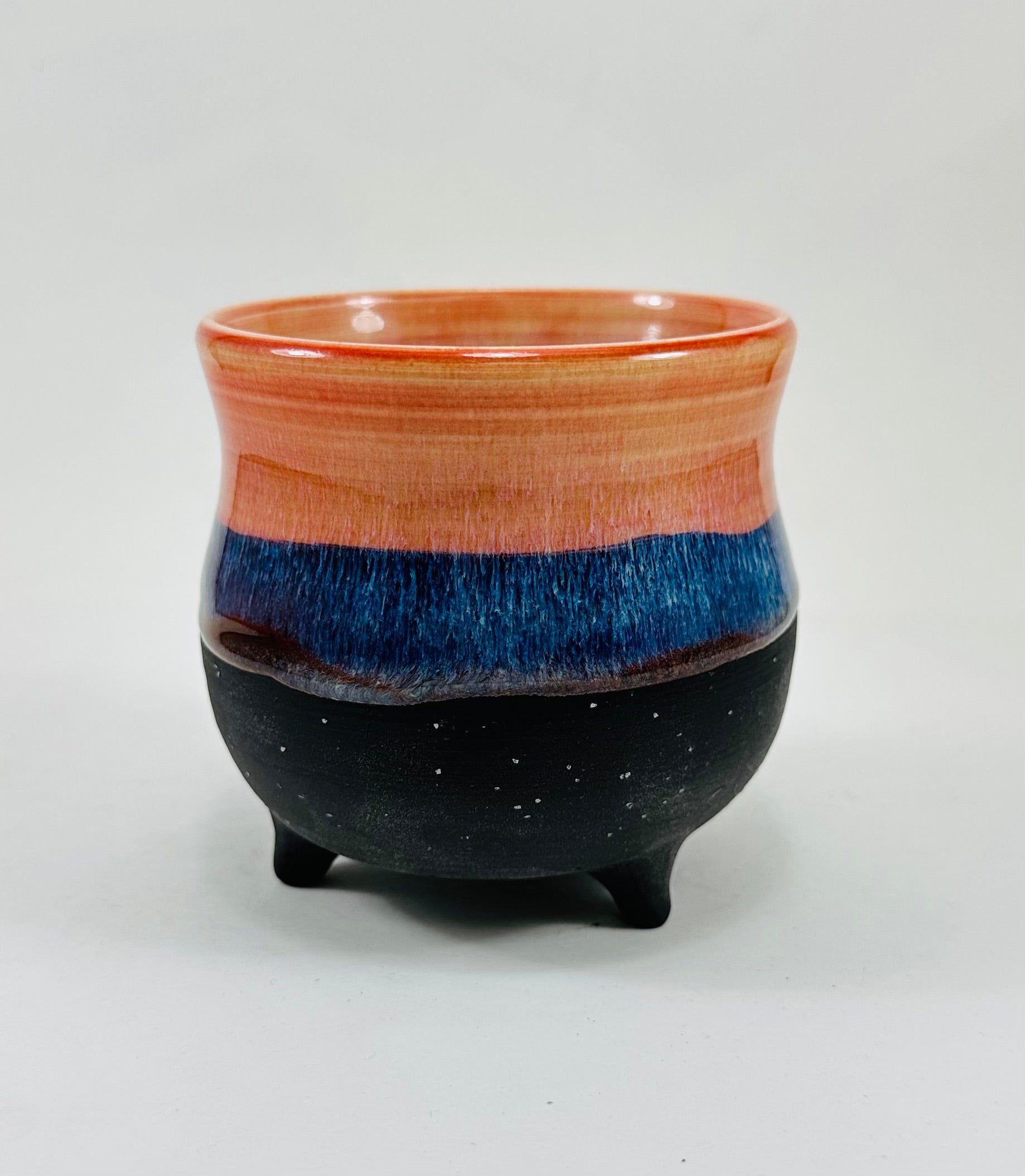 handmade ceramic cauldron in a beautiful peach, blue and black glaze