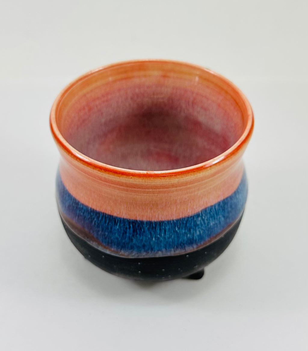 handmade ceramic cauldron in a beautiful peach, blue and black glaze