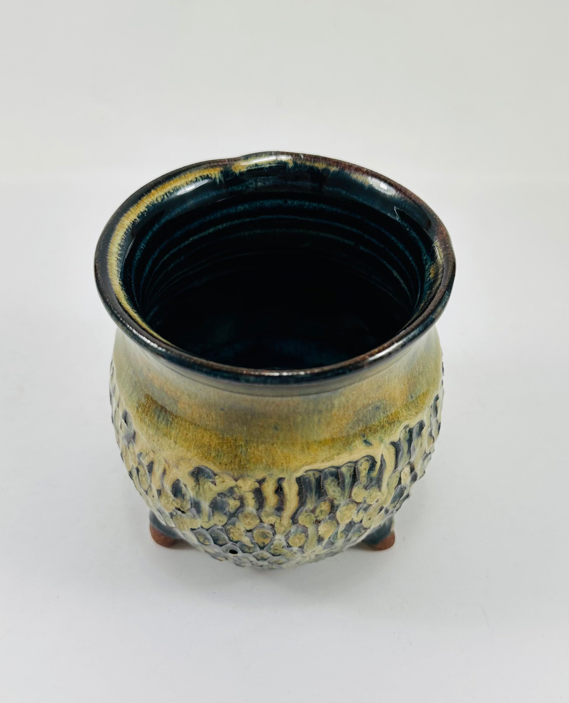 handmade ceramic cauldron in a beautiful brown and yellow glaze