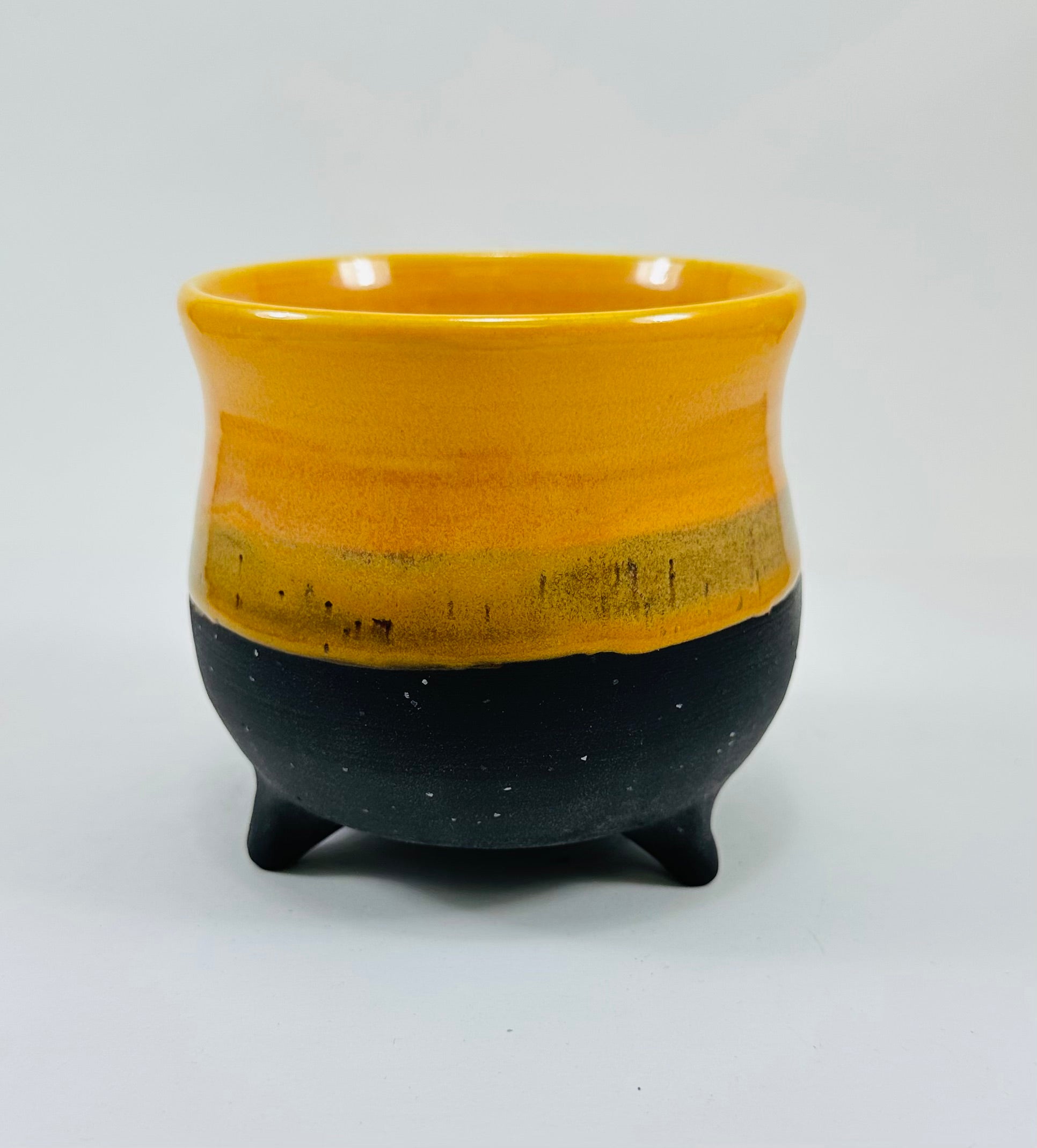 handmade cauldron in a beautiful yellow and black glaze