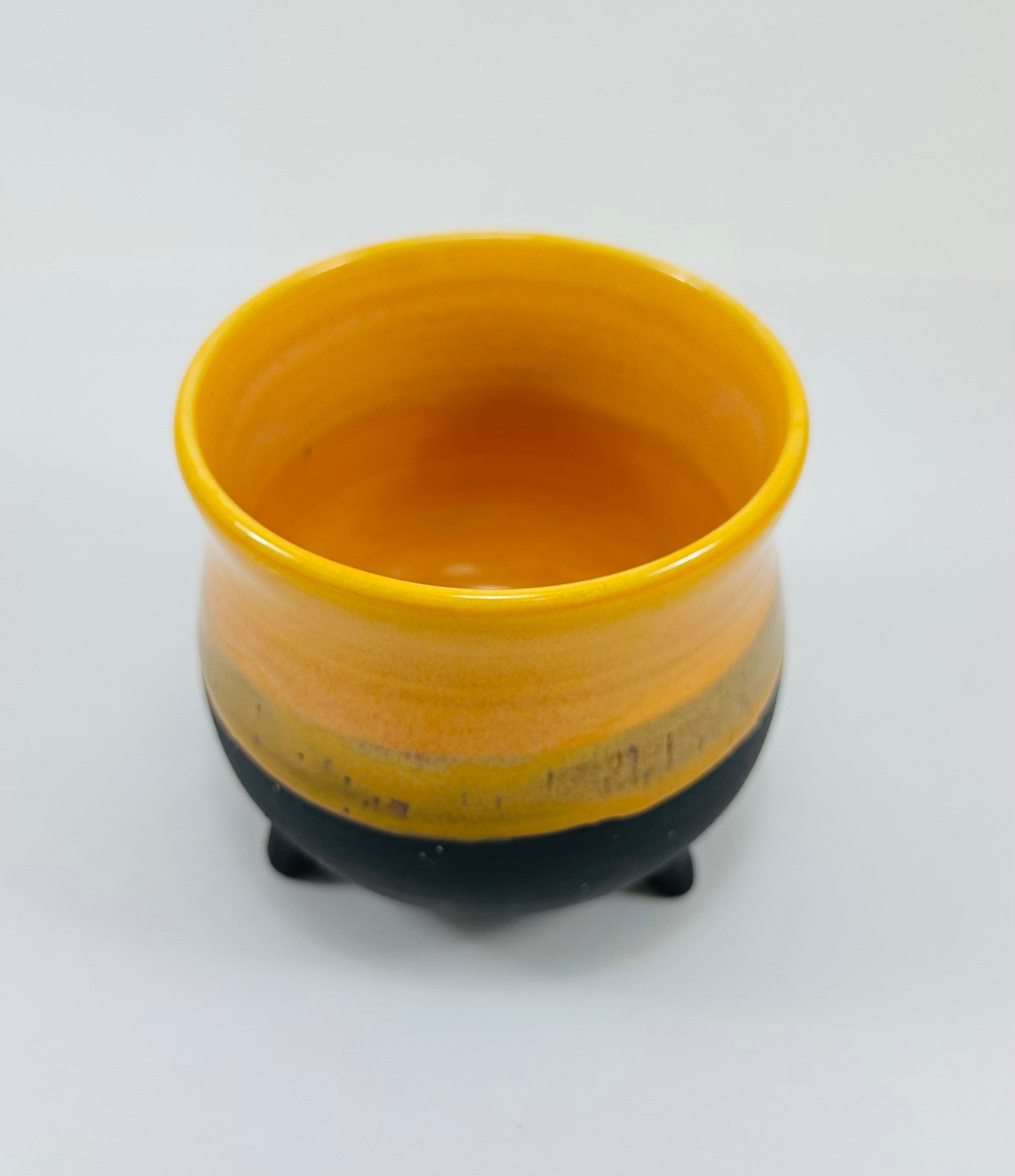 handmade cauldron in a beautiful yellow and black glaze