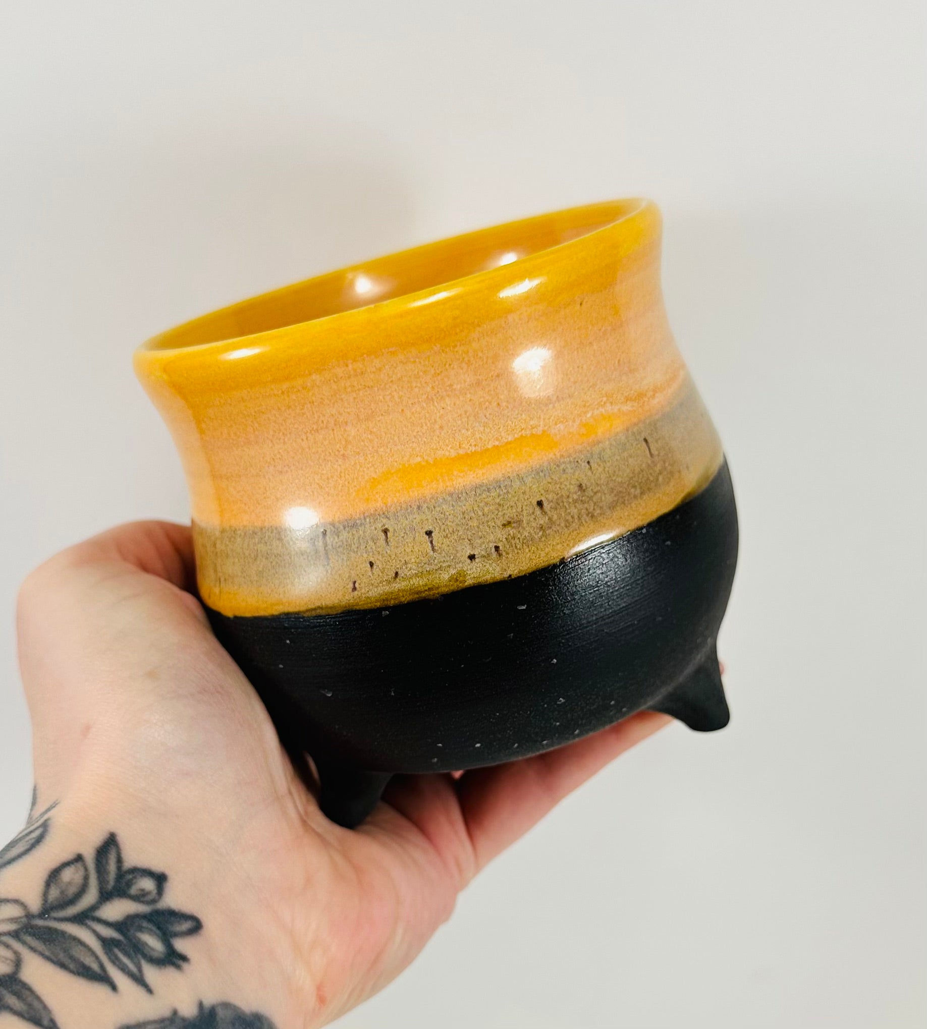 handmade cauldron in a beautiful yellow and black glaze