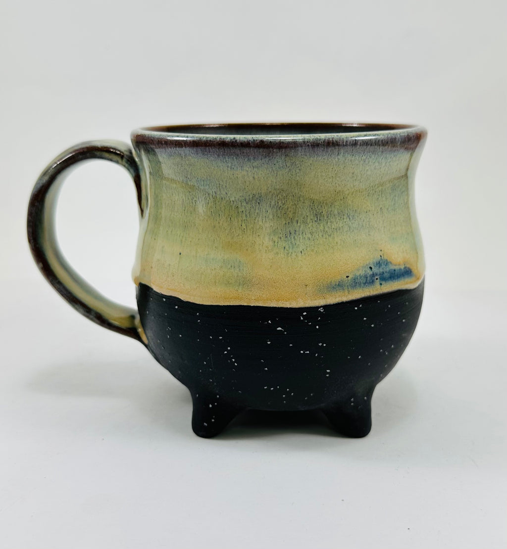 handmade ceramic cauldron mug in a beautiful green/yellow/blue/black glaze
