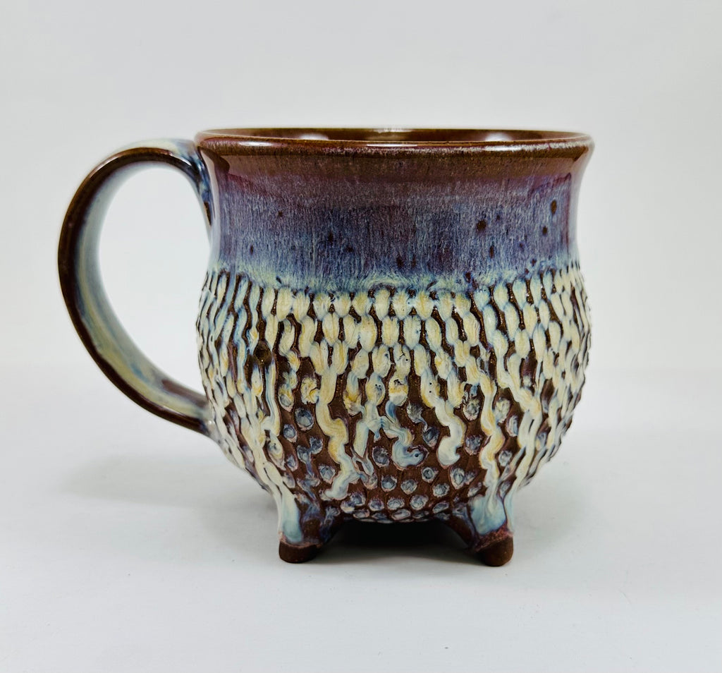 handmade ceramic cauldron mug in a beautiful blue, purple and cream glaze