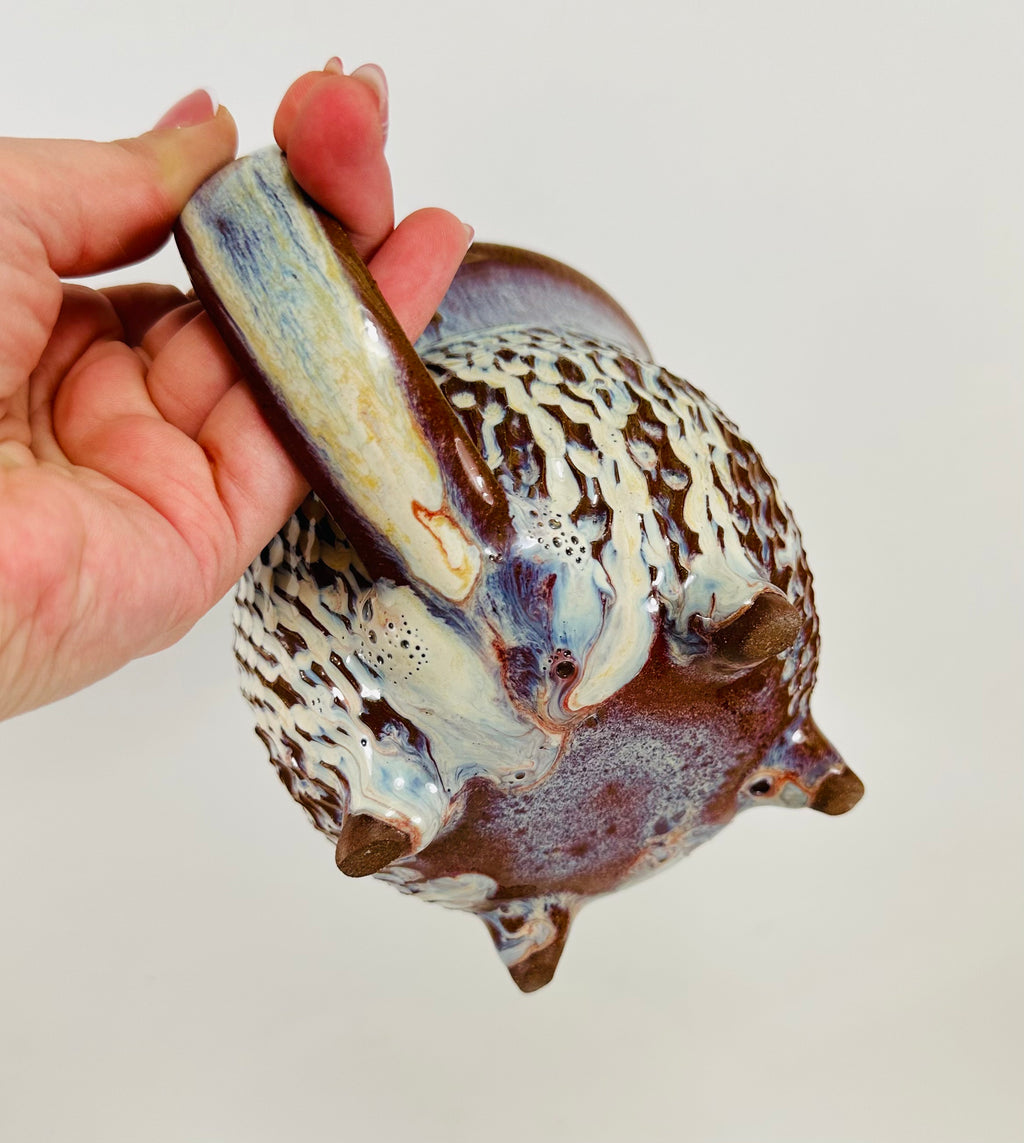 handmade ceramic cauldron mug in a beautiful blue, purple and cream glaze